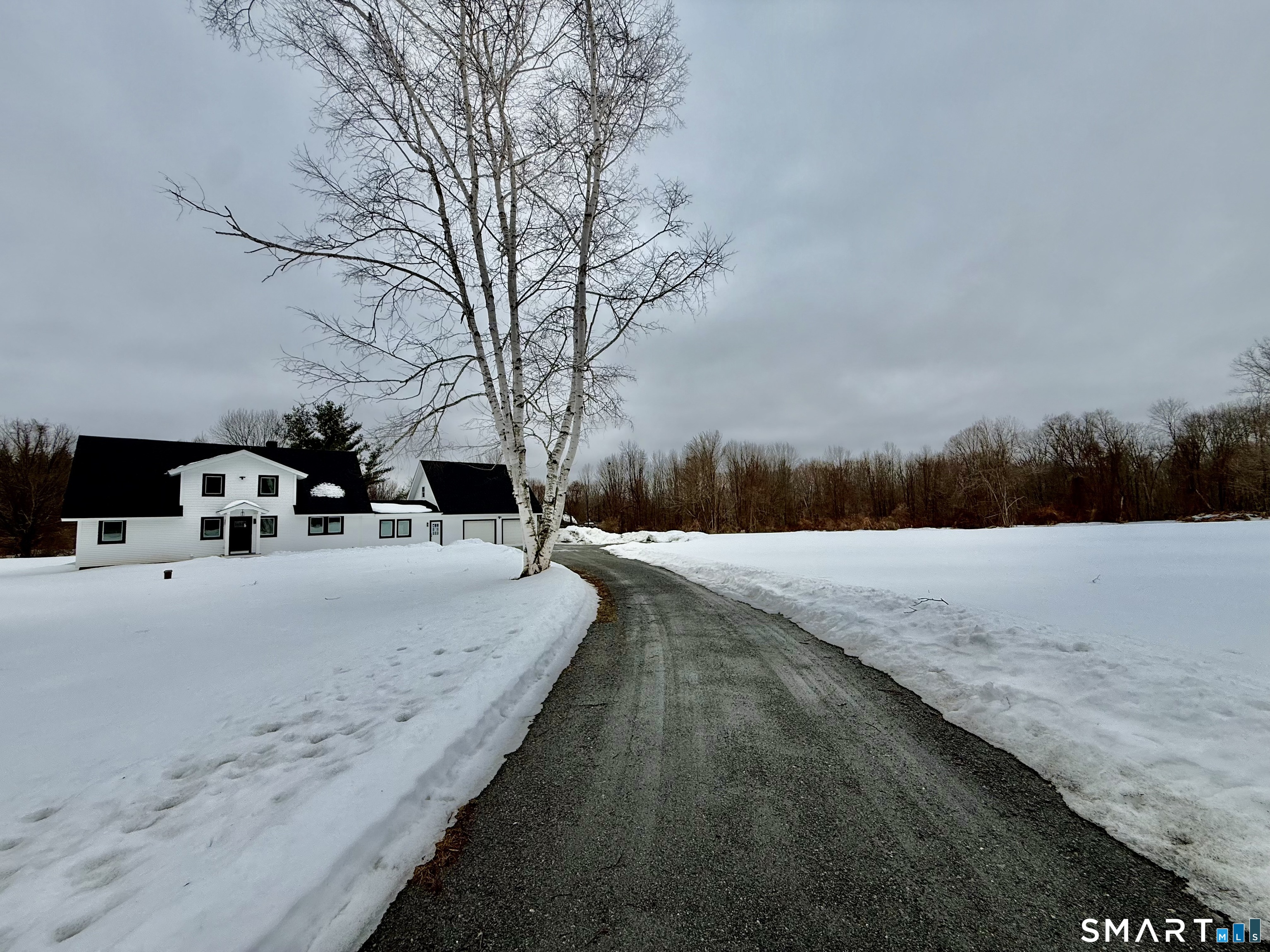 Welcome to this Beautifully updated country retreat set on 5.21 level, cleared acres in beautiful Hebron! Offering 2,884 sq. ft. of thoughtfully designed living space, this Four-bedroom, three-full-bath home combines modern comfort with peaceful surroundings. Office /bedroom with full bath on first floor! New roof, siding, walkway, family room addition, septic tank, Kitchen, 3 full bathrooms, electrical, plumbing, heating system, trex deck, trim, flooring, painting, land clearing and driveway. A spacious family room addition enhances the home's layout, providing the perfect spot for gatherings or quiet evenings in. The interior shines with new electrical, plumbing, furnace, baseboards, painting, and lighting throughout. The beautifully remodeled kitchen features granite countertops, stainless steel appliances, and crisp modern finishes-ready for daily living and entertaining. The new primary bathroom offers stylish updates and quality craftsmanship. So many possibilities with the main floor office and full bath! Additional enhancements include land clearing, new Trek deck, and Ring cameras, delivering convenience, security, and room to roam. Move-in ready and meticulously improved from top to bottom, this exceptional country home offers the space, privacy, and quality you've been looking for-just minutes from Hebron's charming town center, schools, and amenities.