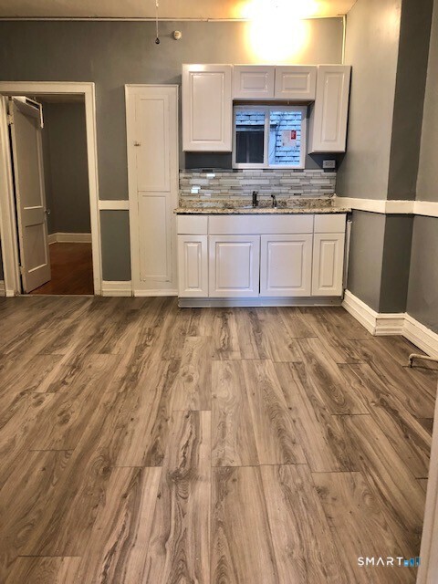 Looking for a large, 2nd floor, one bedroom apartment in the heart of Middletown? If so, this updated and immaculate 4 room unit is it! Upon entering the unit, you will find a neutral and appealing design throughout with beautifully painted walls, gleaming hardwood flooring, bright kitchen cabinetry, updated appliances and one bathroom with a newer vanity and shower/tub combo. This apartment also offers ample closet and storage space as well as built-in cabinets in the kitchen and dining room that bring a touch of the original building charm to this lovely unit. This oversized apartment is located in the heart of downtown Middletown. Everything that historic and lively Main Street has to offer is within walking distance including Wesleyan University, restaurants, shopping, and entertainment. Heat is included in the monthly rent, but the tenant is responsible for electricity, electric hot water, cable/internet, and renter's insurance. A small dog may be considered on a case-by-case basis, but there is absolutely no smoking and no vaping allowed. Please also note that there is no on-site laundry and no off-street or assigned parking.