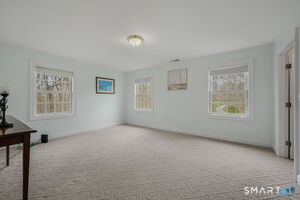 Bedroom 5 of 5 with wall to wall carpet and walk-in closet.