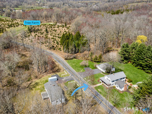 Peaceful country setting on 3.82 acres beside a Tree Farm, with a brook nearby and room to enjoy nature, privacy and outdoor fun.