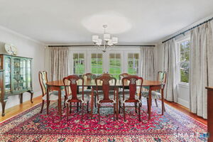 French doors lead to covered porch overlooking the backyard