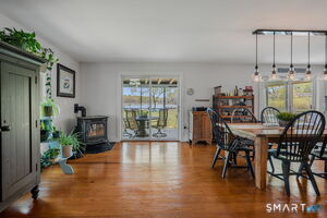 Sliding glass doors open to screen porch