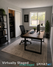 Main floor bedroom staged as an office.