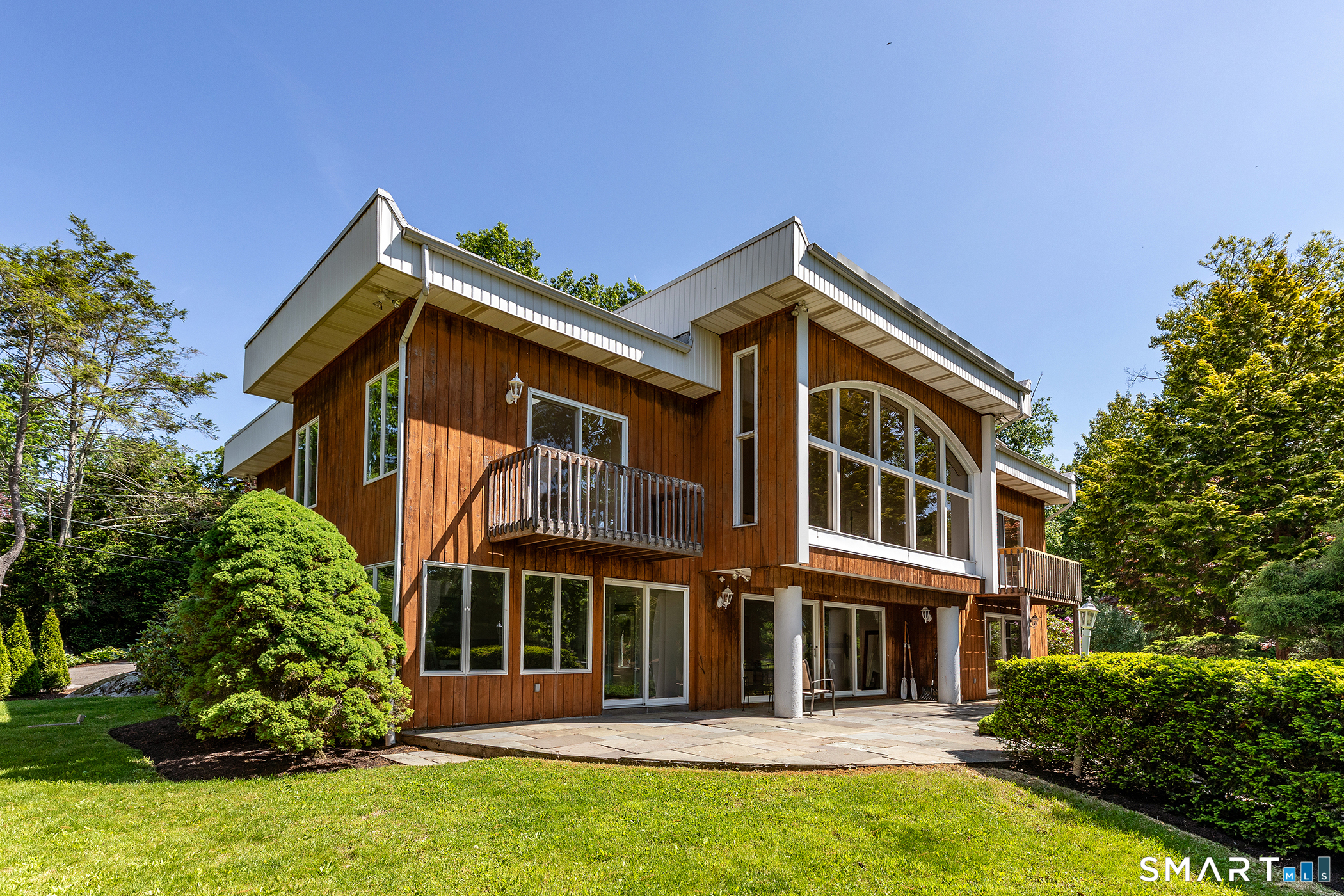 Rare, Level 4 BR, 4 Bath Contemporary Waterfront on Candlewood Lake offering over 3951 SF with amazing southerly views. Two story arched windows bring the outdoors in and offer incredible, wide lake views and level lawn to lakefront beach. The fabulous open plan focuses on a huge great room, with an interior balcony leading to three second floor bedrooms, office and 2 additional full baths. Coal stove for supplemental heat, hardwood floors, and views in all directions. A formal dining room with slate floors and sliders to the patio is adjacent to the updated Kingswood kitchen hosting white shaker cabinets, new appliances, granite counters and matching granite tiled floors. The main level showcases a stunning entry, double set of coat closets and a second full bath plus a huge laundry room/office and 2 car attached garage. Manicured yard, level lot, sand beach, private dock & stunning south facing views make this a unique take opportunity! Close to New Milford town center, shopping , dining , movie theater and easy access to I84. A private oasis in this small Candlewood Lake enclave! Bring your bathing suits, paddle boards , kayaks and just relax! A one of a kind opportunity!