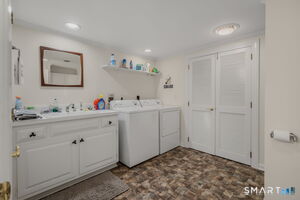 Lower level laundry center and full bath combo.