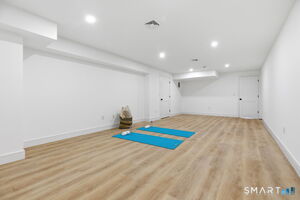 This large recreation room is ideal for a playroom, gym, home office with tons of additional storage.