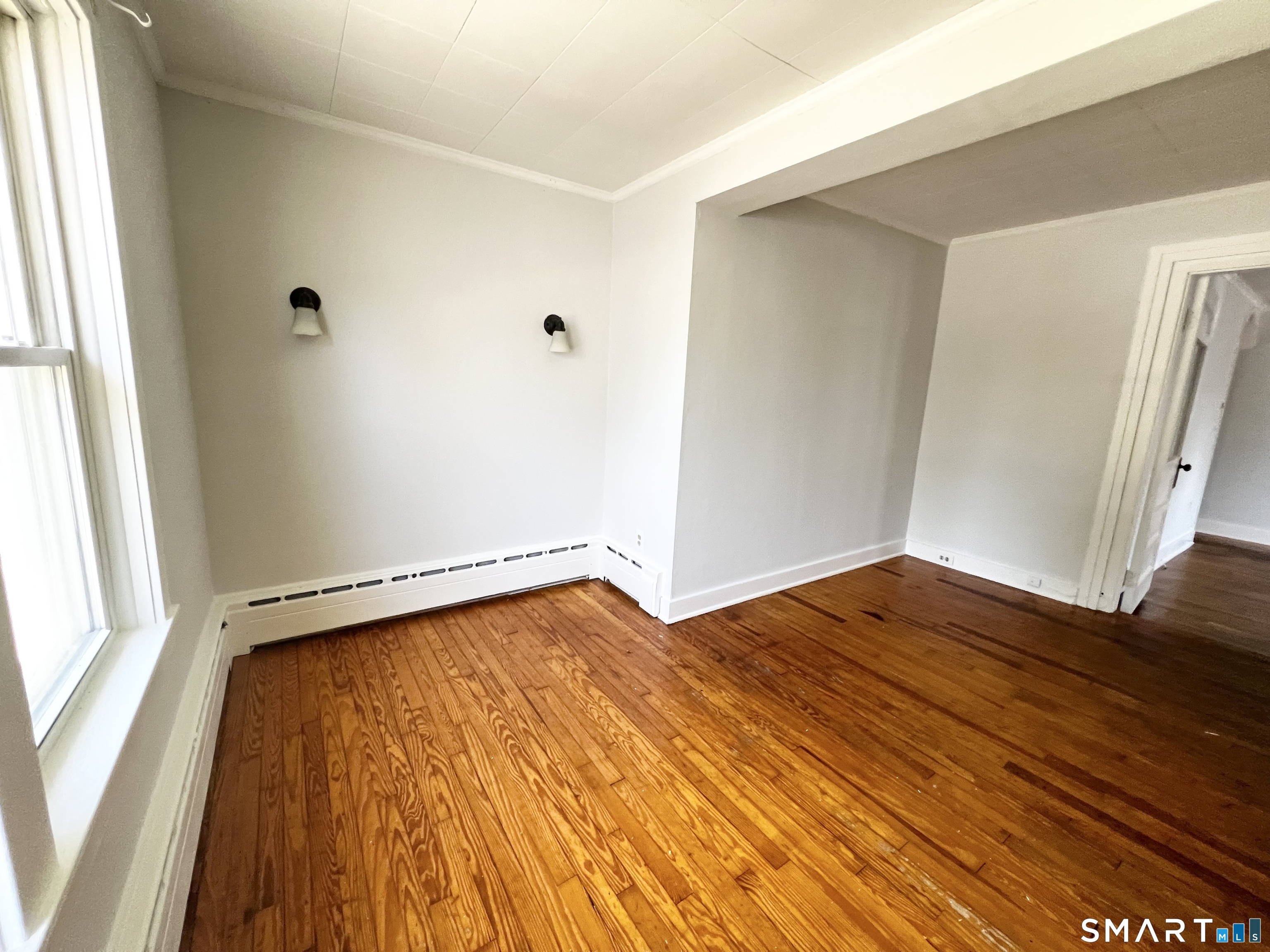 This newly updated 1st floor apartment, with private entrance, features 3 bedrooms and 1 full bath. There are hardwood floors throughout the unit. 2 car off street parking as well as outdoor patio area. The owner would consider a cat for a strong rental application for an additional $50 per month. Strong credit and landlord references a must.  There is also a 1 car oversized garage bay available to rent.
