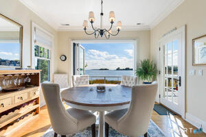 With Accordion glass doors opening to deck, retractable screen doors- Offering the Comfort & Convenience of Dining indoors, though feeling like you're outdoors. Wonderful Seabreeze...
