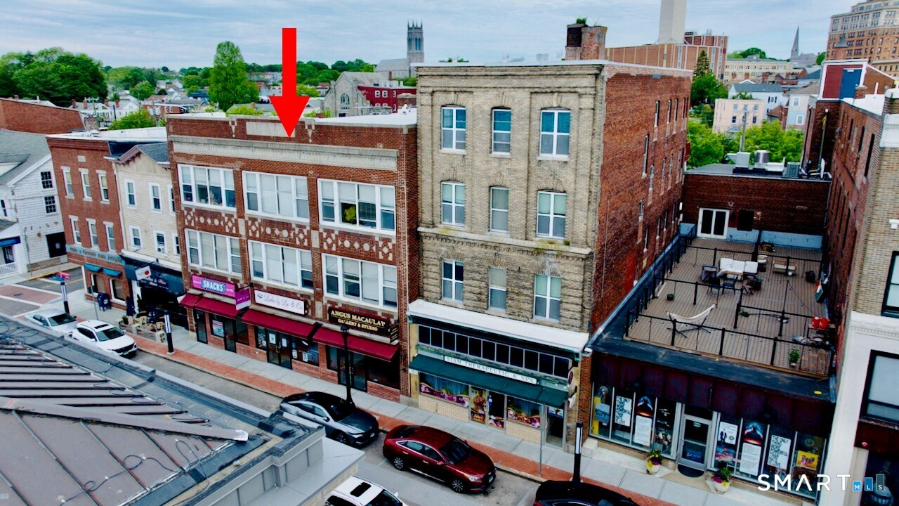 Mixed-use property with 4 commercial units and 6 apartments located in the heart of downtown New London. This 17,378 SF, 3 story building has 4 commercial units in 3,942 SF on the ground level SF commercial and 6 apartments on the 7,884 SF second and third floors. There is a 3,942 SF basement.  NOI approximately $117,227. Two of the commercial units are recently vacant so there is room to increase NOI. Call office for financials. Excellent investment property with stable cash flow. Property may be purchased as a package with 53 Bank St and 147 Bank Street for a total of 6 commercial units and 17 Apartments.