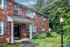 Step beneath an overhang above your front door.