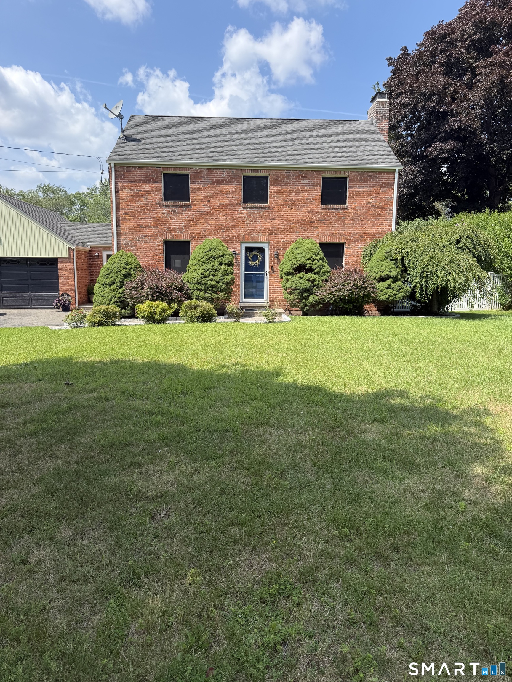 This pet friendly home includes hardwood floors throughout and comes fully furnished! Two lots in one, the property boasts over three acres of level, cleared land that is entirely fenced in! The kitchen is quite large with granite counters, tile backsplash, huge, moveable island with four stools and overlooks the deck and back yard. The living room is front to back and has a wood burning fireplace with built-in book shelves and a picture window overlooking the back yard and patio. The formal dining room has two corner hutches. Head up to the second floor and enter into a huge foyer - perfect for a small home office. There are 2 standard bedrooms with large closets, a primary bedroom with large closet and small walk-in closet and a full bath on this level. The lower level is partially finished with a wood burning fireplace and decent storage including a root cellar. There is a 3/4 bath down here - its funky, and not a showstopper, but if you have vision you can make it cute and it will be perfect when using the lower level family room or for grubby kids or adults! The property has a nice back deck, patio, two car attached garage and central air. All utilities included! The only thing a tenant has to worry about is snow removal, and for that, there is a snowblower! Flexible lease terms - owner prefers no less than 3 months.