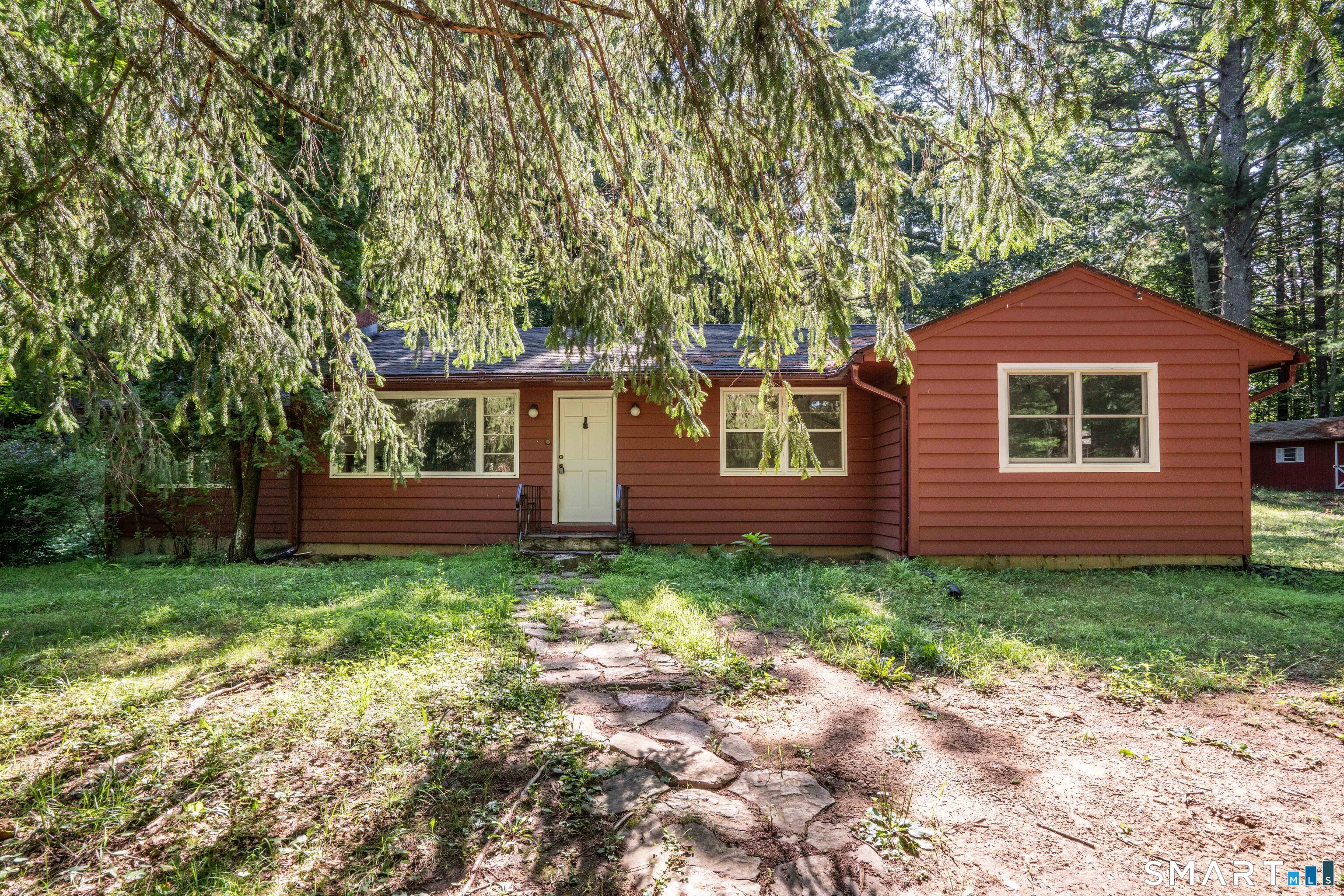 Nestled on a private, serene, 2-acre wooded lot, this one-of-a-kind ranch offers the perfect balance of peaceful seclusion and everyday convenience. Just a quick ride to UCONN and within walking distance of the Nipmuck Trail and the scenic Fenton River, you'll enjoy nature at your doorstep, without being far away from everyday conveniences. This thoughtfully updated home features brand-new, state-of-the-art mechanical systems, newer Andersen windows that fill the home with natural light, new gutters, and a freshly painted exterior. Inside, hardwood floors, fresh paint, cedar-lined closets, and a unique cedar-lined bathroom with a soaking tub create a warm and inviting atmosphere. The open kitchen combines modern appliances with artistic character, but the family room is by far the best room in the house, with picture windows that let in lots of natural light and a wood stove to keep you warm in the winter. If you're looking for privacy, nature, and exceptional updates in a truly unique home, this property is a rare find.
