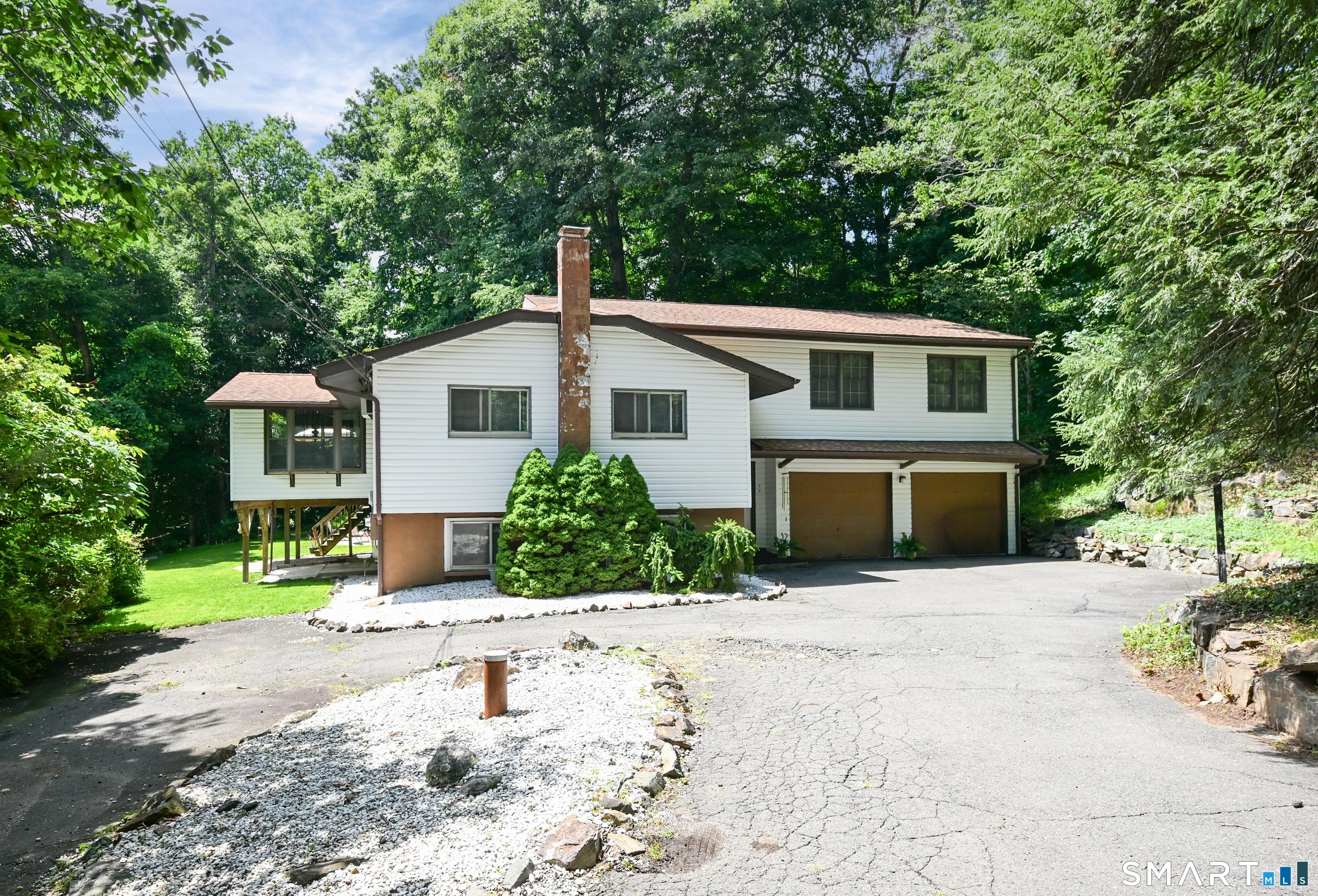 A wonderful opportunity to own a move-in ready home with flexible living space! A spacious 4 BR, 3 full bath Split-Level home located in the Candlewood Hills community close to Candlewood Lake and Squantz Pond. The home offers a versatile floor plan and features an ideal setup for multi-generational living with a private lower-level in-law suite complete with a full bath, or use the space as a family room, home office, or guest quarters. The upper-level primary suite is a peaceful retreat with vaulted ceilings, a full bath, cozy sitting area along with it's own private deck overlooking the wooded backyard. Two additional generously sized BR's share an updated full bath on the main level. The casual eat-in kitchen flows to the deck, creating the perfect setting for outdoor entertaining or relaxing around the fire pit in the private backyard. Additional highlights include updated baths, an economical wood stove, generator hookup just in case and plenty of storage and parking. Conveniently to New Fairfield, New Milford, and Sherman with everything the area has to offer including the Candlewood lake and Squantz Pond parks.