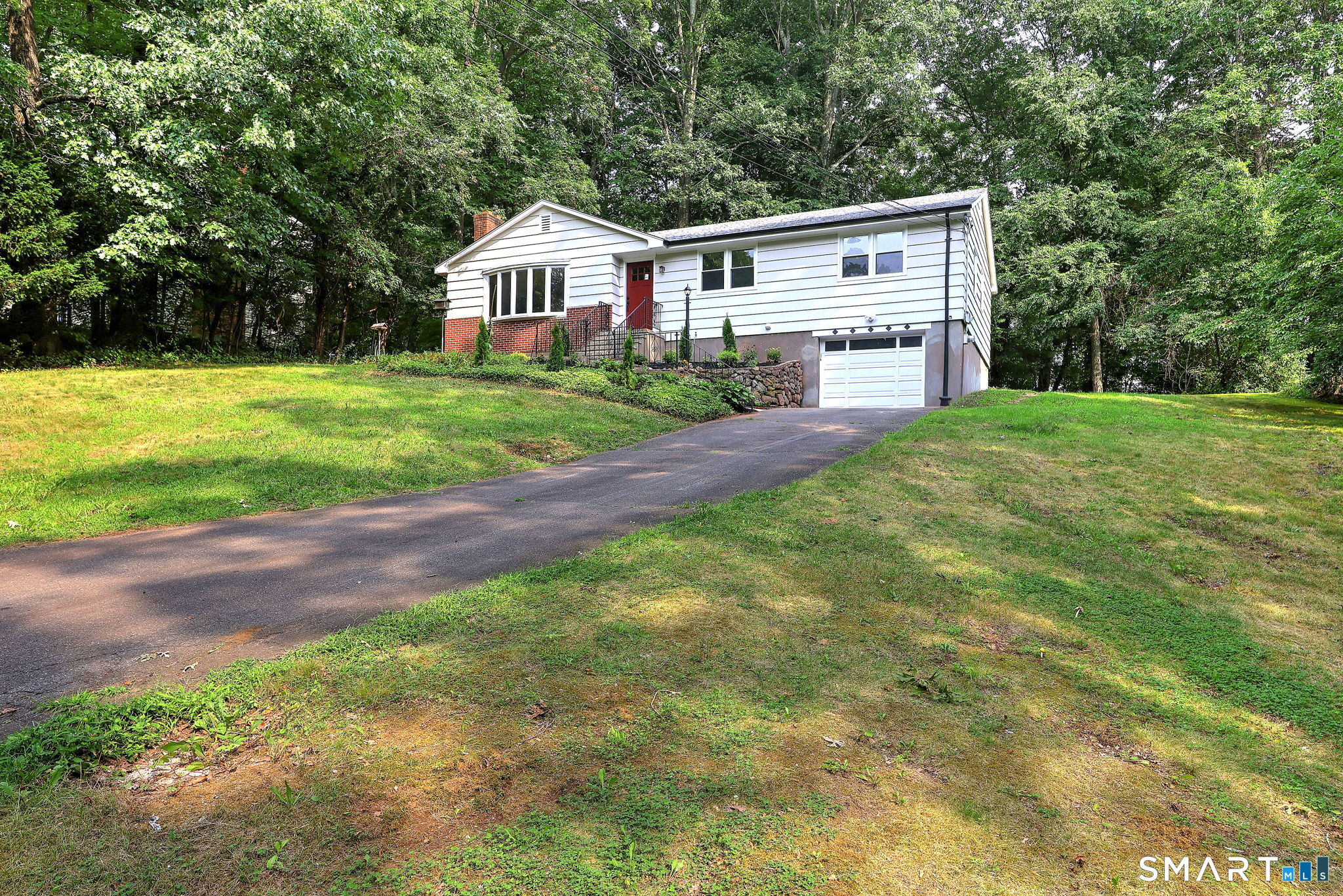 Welcome to 46 Forest Court North! Beautifully remodeled home in a highly desirable neighborhood. Move right in to this 3 bedroom, 2 and 1/2 bath ranch with over 2100 sqft of living space. The main level includes completely new kitchen w/sliders to deck, sunken living room w/fireplace, 3 bedrooms and 2 brand new full baths! The primary bath has radiant floor heating and a lip free shower. Continue to the lower level to find a family/tv room w/built-ins, laundry room and separate 1/2 bath. Two additional flex spaces for office, gym, etc. New HVAC including Central A/C. Make your appointment to view today!