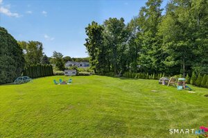 huge level yard, with a storage shed and garden