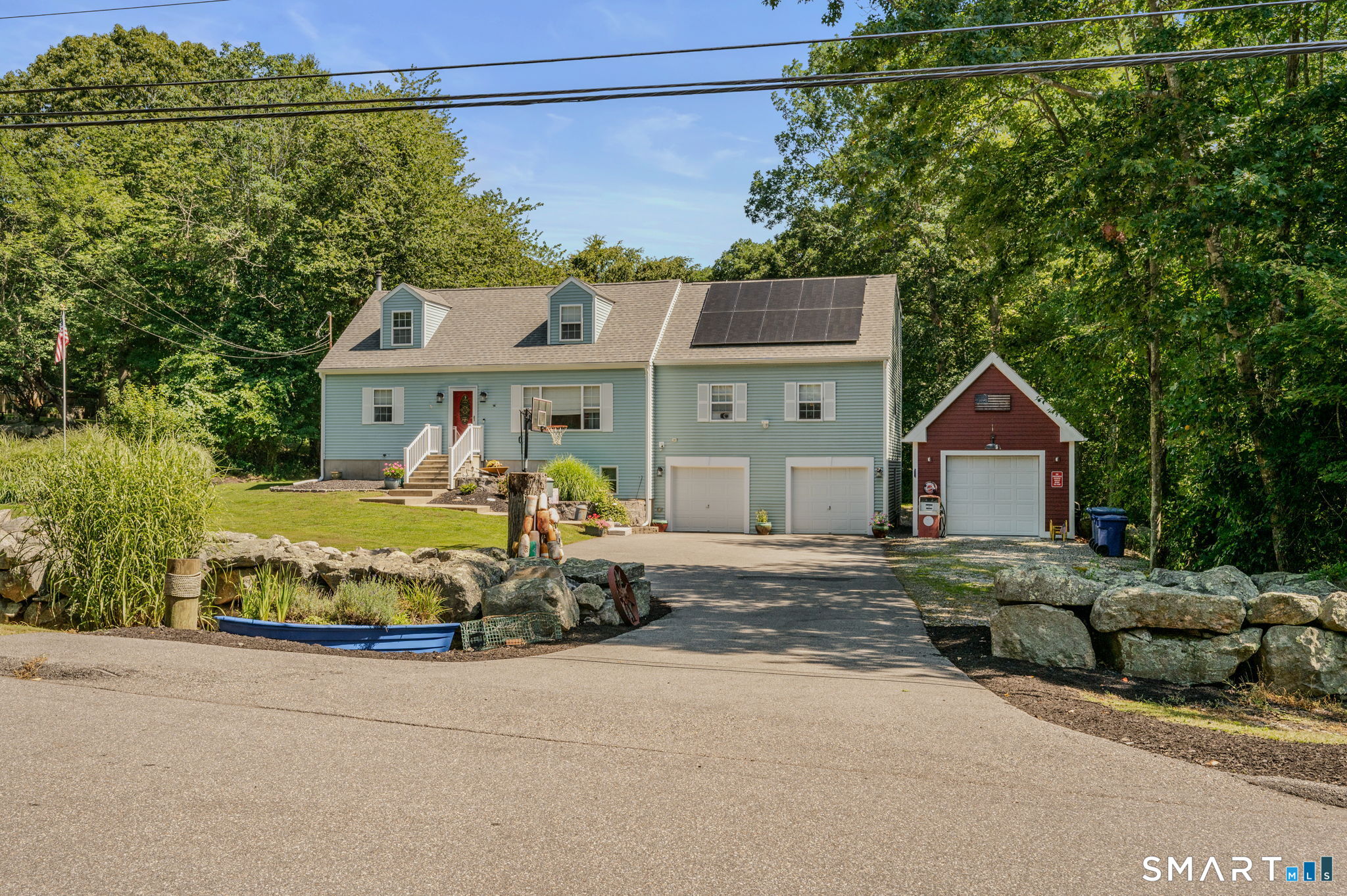 Welcome to 35 Pepperbox Road in Waterford, where location, space, and versatility come together! Ideally situated near Waterford Beach and Harkness Memorial State Park, this home offers the perfect setting for enjoying the Connecticut shoreline lifestyle. Inside, you'll find generously sized rooms and an inviting open floor plan designed for comfortable everyday living and entertaining. Step outside to a large deck overlooking the expansive backyard, providing plenty of room for outdoor gatherings, recreation, gardening, or simply relaxing. For those who appreciate exceptional garage space, this property truly stands apart. There is parking for four cars, an attached garage, and a detached garage featuring a professional-grade car lift. The detached garage is an absolute dream space for the car enthusiast, hobbyist, or anyone needing serious workspace and storage. With its combination of large living spaces, incredible garage amenities, spacious outdoor areas, and proximity to the beach and Harkness Park, 35 Pepperbox Road offers a rare opportunity to enjoy both comfort and the coastal lifestyle.