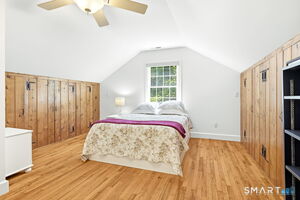 Loft area off of the living room used as bedroom with full bathroom. Both side walls are closets. Great storage!