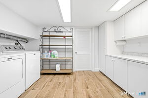 Massive laundry room with tons of storage.