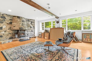 Lower level family room with private entrance. Can be used as in-law apartment.