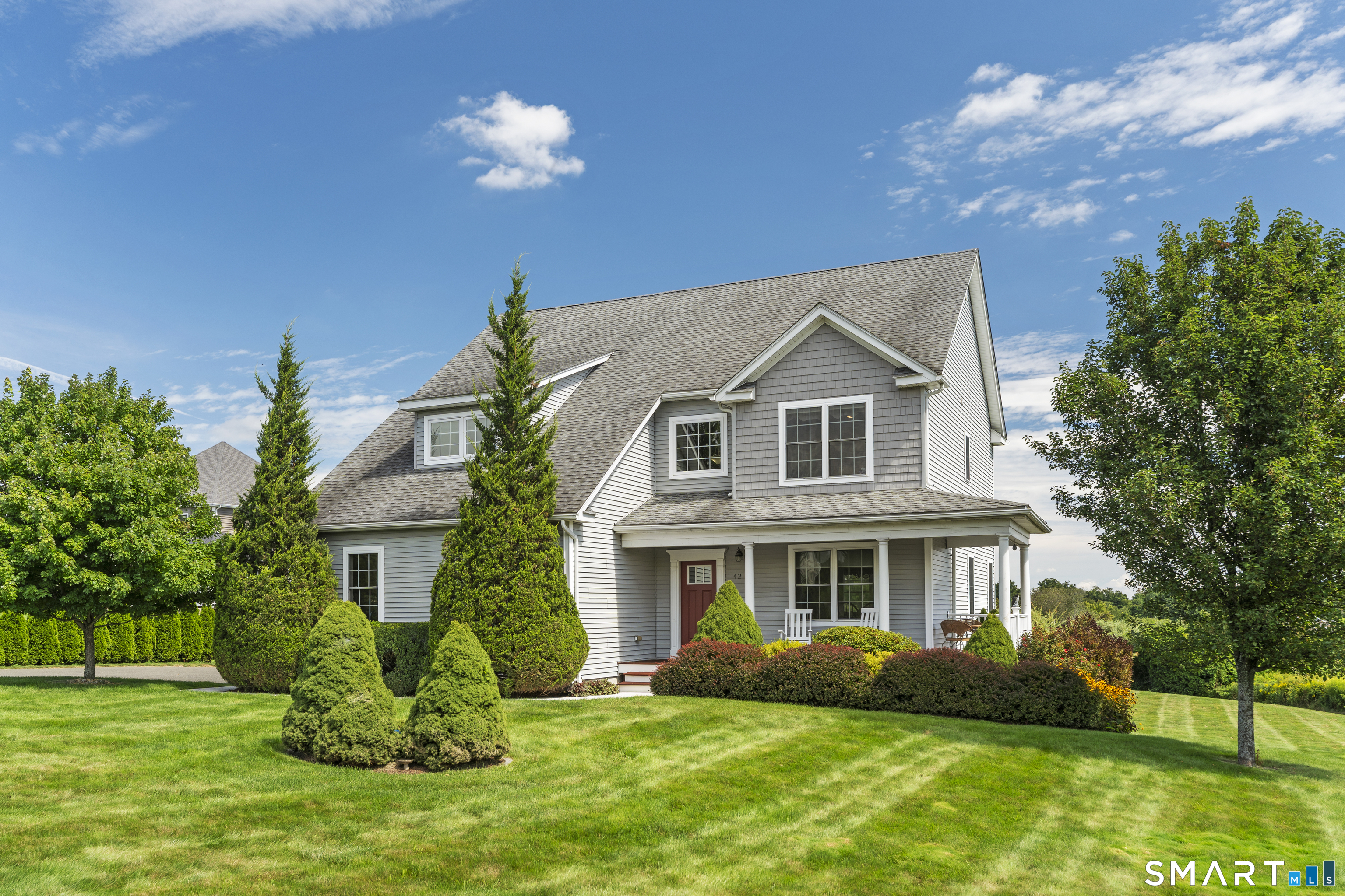 Welcome Home! Set on a spacious 2.92-acre lot overlooking preserved farmland, this one owner, custom built beautifully appointed 4-bedroom, 2.5-bath home offers an exceptional blend of comfort, functionality, and tranquil surroundings. Enjoy both beautiful sunrise and sunset views and peaceful rolling hills from this thoughtfully designed property. The open-concept first floor features hardwood flooring throughout and a stunning kitchen with solid wood cabinetry, granite countertops, stainless steel appliances, and a convenient pantry. The kitchen flows seamlessly into the living room, complete with a gas-insert fireplace, smart thermostats for comfort and surround-sound speaker system, creating an inviting space for both everyday living and entertaining. The dining room features an attractive inlaid decorative hardwood border. A convenient mudroom/drop zone and powder room are located just off the oversized 3-car garage, which includes a workbench and built-in storage. An electric vehicle charging station and installed invisible-fence pet containment system add even more versatility. Upstairs, four bedrooms surround a comfortable sitting area overlooking the dramatic two-story foyer. The spacious primary suite features hardwood flooring, a private bath with an updated tiled walk in shower and a large walk-in closet. Two bedrooms feature newer carpet installed approximately one year ago while the 4th bedroom has hard wood and is currently serving as a private home office.