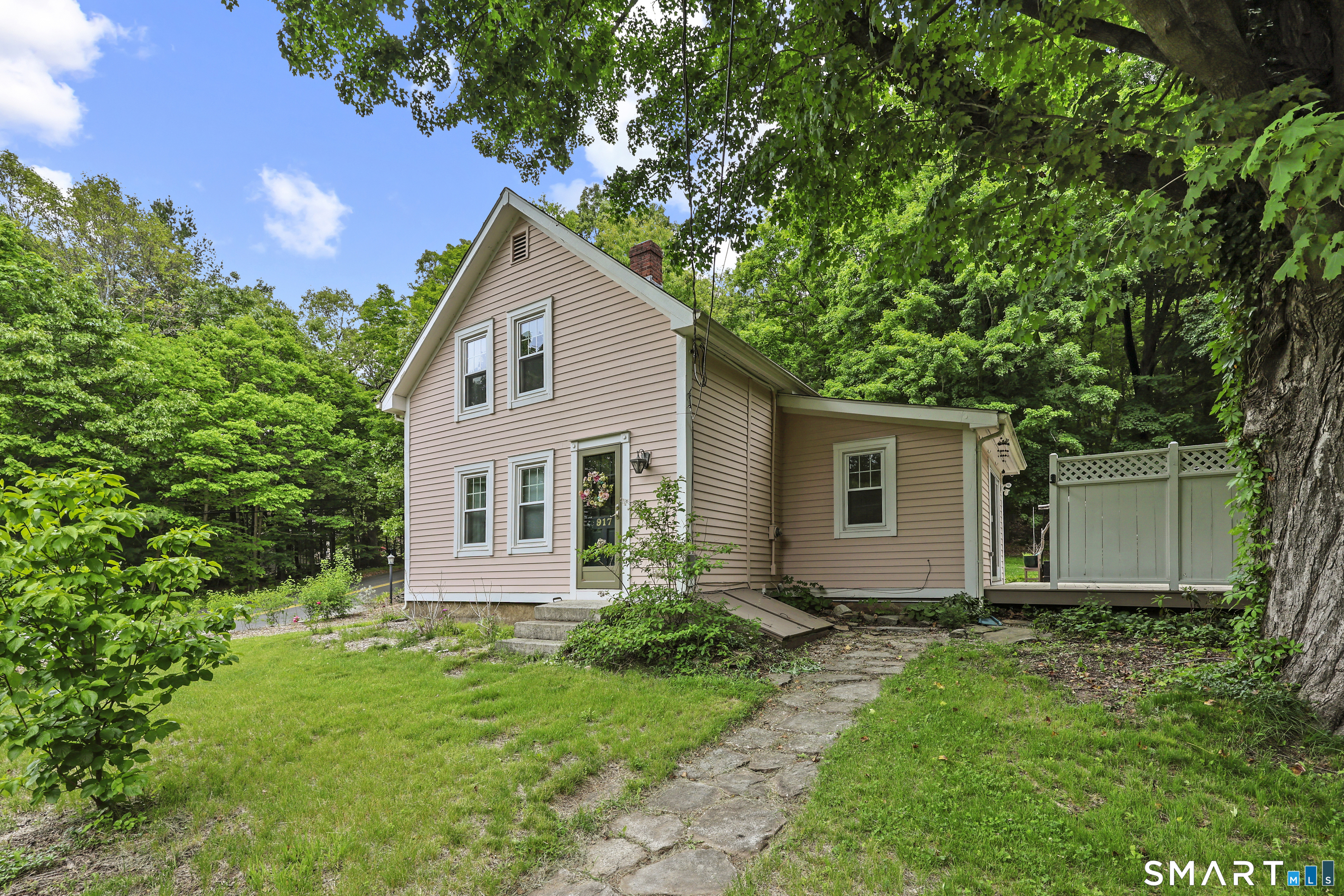 Brand New Roof & Skylight & A Brand New Price!! Charming New England-style farmhouse in desirable South Glastonbury! This 2-bed, 2-bath Colonial perfectly blends historic character with modern updates. Inside, you will find exposed beams, wide-plank wood flooring, recessed lighting, and skylights that fill the home with natural light. The spacious living room offers a warm, inviting space to relax, while the kitchen features updated appliances and flows effortlessly into the dining area and breakfast nook-an ideal layout for entertaining. The primary suite includes a private bath. The second bedroom is bright and comfortable, perfect for guests or a home office. Outside, you will find a private large, level yard and the sunny deck are made for outdoor gatherings. The mature landscaping is a gardener's dream. Highlighting sustainable hugelkultur gardens and an abundant variety of fruits, and flowers and trees, including apple, peach, cherry, fig, persimmon, and various berries alongside native perennials. Minutes from popular South Glastonbury restaurants and shops, Cotton Hollow and trails. While town records list the homes age as 1989 (renovation year) The Home is believed to date back to the mid-1800s. There are updated windows. New in 2022: well, dry well, water treatment/softener system, hot water heater, washer, dryer, refrigerator, dishwasher, and barnyard shed. Additionally there is an outdoor shed with power for home office. Come see it Today!