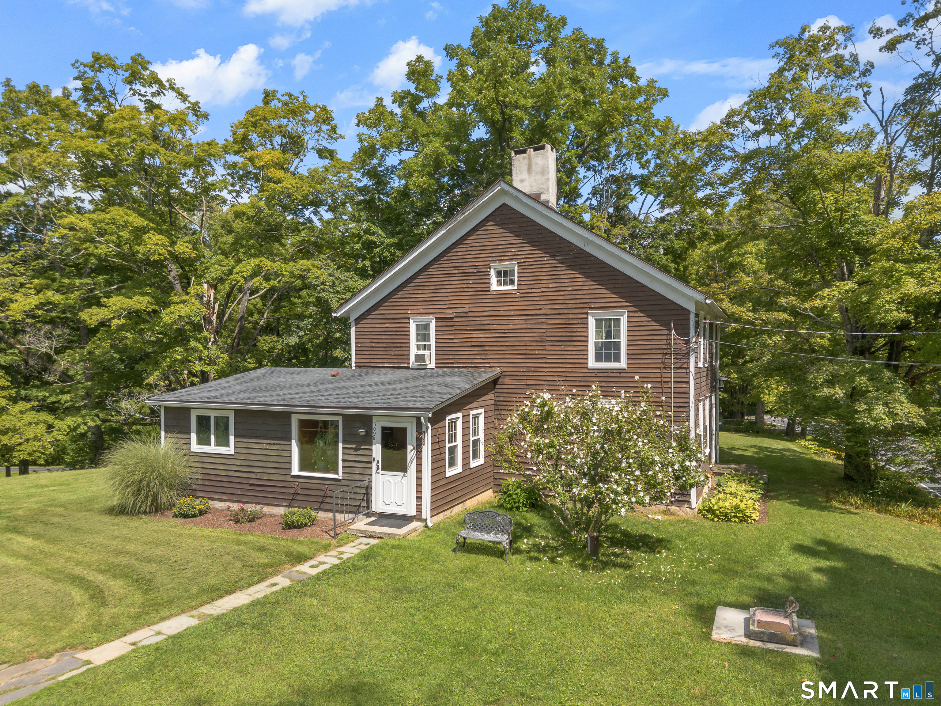 Charming Circa-1920 Farmhouse in the Heart of the Harlem Valley Nestled along one of Amenia's picturesque country roads, 309 Amenia Union Road is a charming circa-1920 farmhouse set on approximately 2 private acres in the heart of the Harlem Valley. Surrounded by rolling fields, mature trees, and neighboring farmland, this property captures the quintessential character of the Hudson Valley countryside while offering exceptional potential for its next owner. Dating to the early 20th century, the farmhouse retains the proportions and character that make historic country homes so appealing. Approximately 1,920 square feet of living space includes 4 bedrooms and 1 full bathroom, with a traditional two-story floor plan that provides a wonderful foundation for restoration, renovation, or personalization. Sun-filled rooms, generous living spaces, and classic farmhouse proportions create an inviting sense of warmth and possibility. The main living areas offer plenty of flexibility for modern country living. A spacious living room provides a comfortable gathering space, while the dining area lends itself beautifully to family meals, entertaining, or relaxed weekend dinners with friends. Four bedrooms offer room for family, guests, a home office, or creative space, allowing the floor plan to evolve with the needs of its next owner. Outside, approximately two acres provide a peaceful private setting with room to create the country property you have envisioned. There is ample opportunity