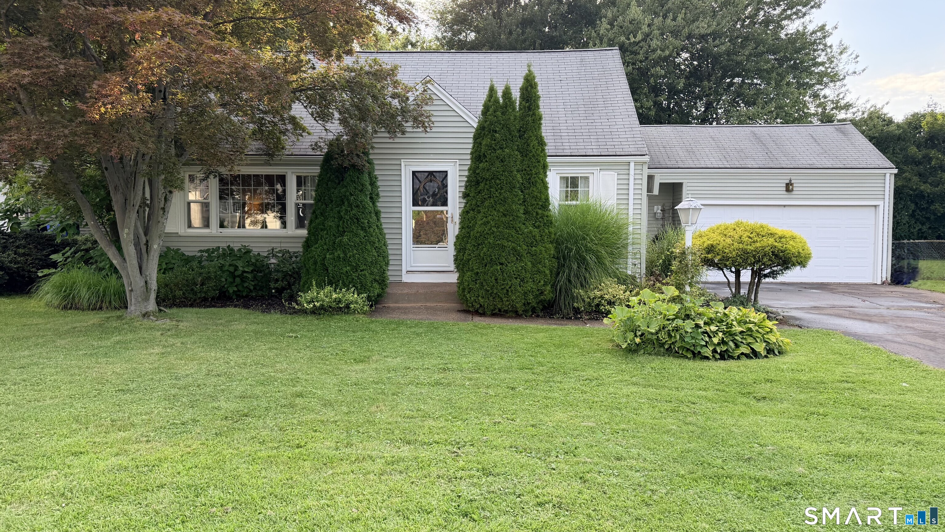Curb appeal is just the beginning! Step inside this beautifully appointed 3-bedroom, 2-full-bath home offering over 1,600 square feet of living space, also an enclosed porch and finished lower level (not included in the square footage)-giving you even more room to enjoy. Gorgeous hardwood floors throughout and a spacious, open layout set the stage for easy everyday living and entertaining. The updated kitchen features quartz countertops, a butcher-block island and stainless steel appliances, creating a natural gathering place at the heart of the home. Just beyond, the inviting family room with fireplace and sliders to the enclosed porch offers wonderful indoor-outdoor flow for relaxing, hosting and making memories. Upstairs, you'll find two generously sized bedrooms, including a spacious primary with two closets, along with an updated full bath. Need even more room? The finished lower level with vinyl flooring offers endless possibilities-recreation room, home office, gym, guest space or additional gathering area-plus plenty of storage. Outside, enjoy a level, fenced-in yard, 2-car garage, vinyl siding and updated windows. With its welcoming curb appeal, generous living space, thoughtful updates and terrific entertaining flow, this is a home you will want to see! Professional photos coming soon