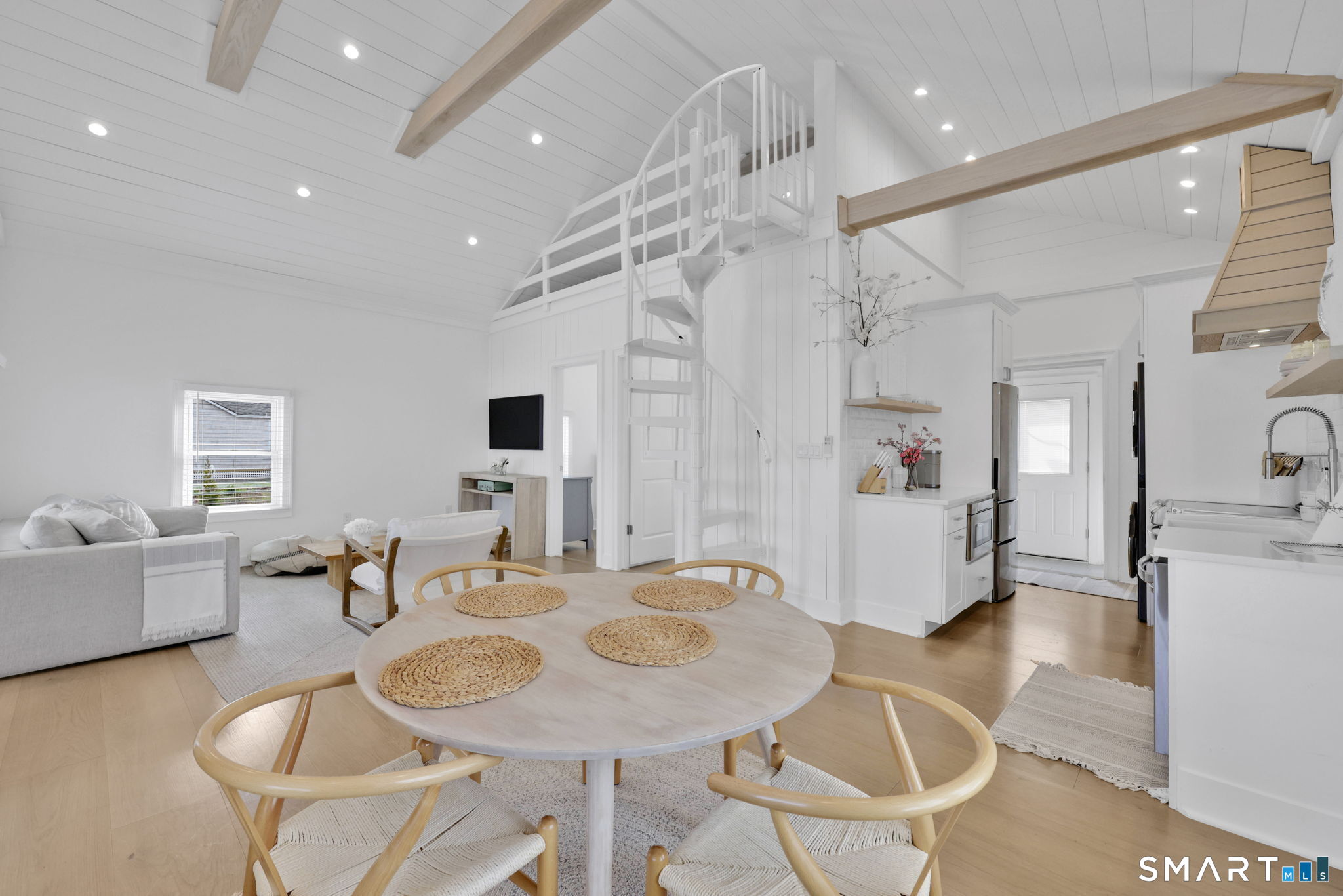 MOVE-IN READY AND UPDATED HOME AT CLINTON BEACH. Come enjoy the cutest cottage on Shore Rd. EXTENSIVELY RENOVATED. Just steps to the beach and minutes away from town and all of the CT shoreline attractions. DIRECT BEACH ACCESS ACROSS THE STREET. This newly renovated cottage has all the modern amenities of today and all the old charm of yesterday. HEATED FOR YEAR ROUND COMFORT. The cottage features water views, a fully equipped kitchen, washer/dryer, and dishwasher. The cottage sleeps up to 6 (1 queen,1 bunkbed, and 1 sleeper sofa) and has parking for 2 cars. Private beach club located down the road. Upper level loft offers space (not included in sq ft). Easy access to I-95 and town amenities.