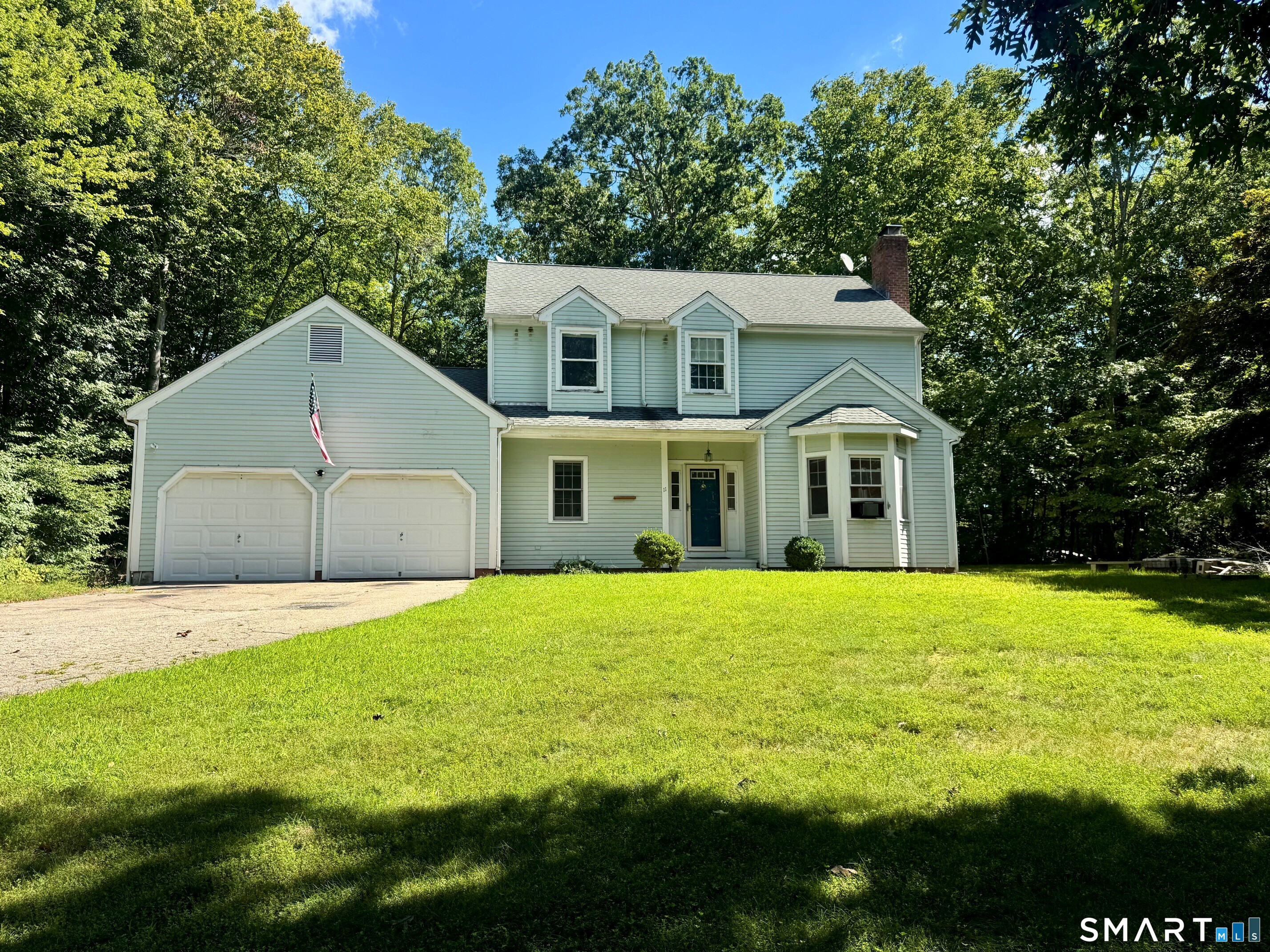Welcome to 11 Ebony Lane, a spacious 4-bedroom Colonial set on over an acre in the desirable Ivoryton Woods neighborhood of Essex. Offering a wonderful floor plan with 9-foot ceilings on the main level, this home features an eat-in kitchen that opens seamlessly to the family room, where sliding doors lead to a large private deck overlooking the level backyard-perfect for outdoor dining, entertaining, or simply enjoying the peaceful setting. Beautiful hardwood floors enhance the inviting living and dining spaces, while the front-to-back living room features a fireplace and plenty of natural light. A first-floor bedroom provides wonderful flexibility and could easily serve as a home office, den, guest room, or playroom. Upstairs are three additional bedrooms, including a generously sized primary bedroom with a private full bath. There is a full basement with more room for a home gym or workshop. A top-of-the-line Buderus furnace was installed approximately 4 years ago, and the roof is approx. 11 years old. An attached two-car garage provides additional storage, and the expansive, level lot offers plenty of room for gardening, recreation, and outdoor enjoyment. Located just minutes from the charming villages of Ivoryton and historic Essex, with easy access to restaurants, shops, marinas, the Connecticut River, and all that the Connecticut River Valley has to offer. **Please note: the central air conditioning system is currently in need of a new compressor.**