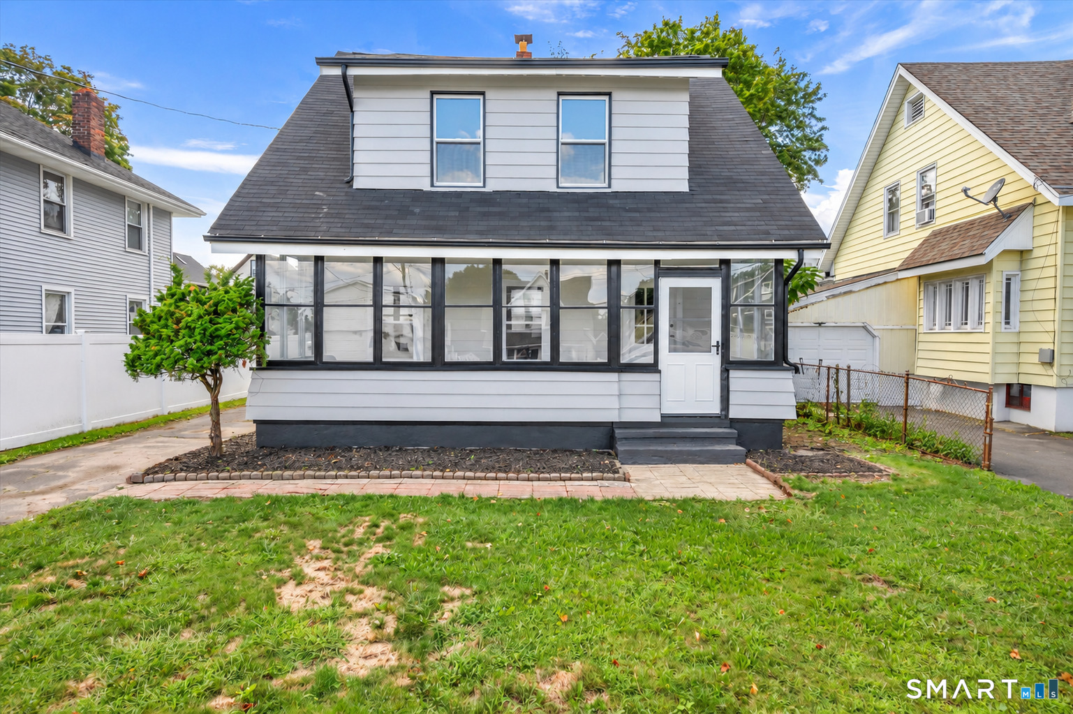 Welcome home to this charming and beautifully updated West Haven home, ideally located just 8 minutes from West Haven's beaches and approximately 6 minutes from the West Haven train station, making it a great option for commuters and anyone who loves being close to the shoreline.  Step inside through the spacious screened-in front porch, the perfect spot to enjoy your morning coffee, relax with a book, or unwind at the end of the day. Inside, you'll find a bright and inviting interior featuring beautiful hardwood floors, fresh neutral finishes, and plenty of natural light throughout. The updated kitchen offers white cabinetry, stainless steel appliances, modern finishes, and a clean, contemporary feel.