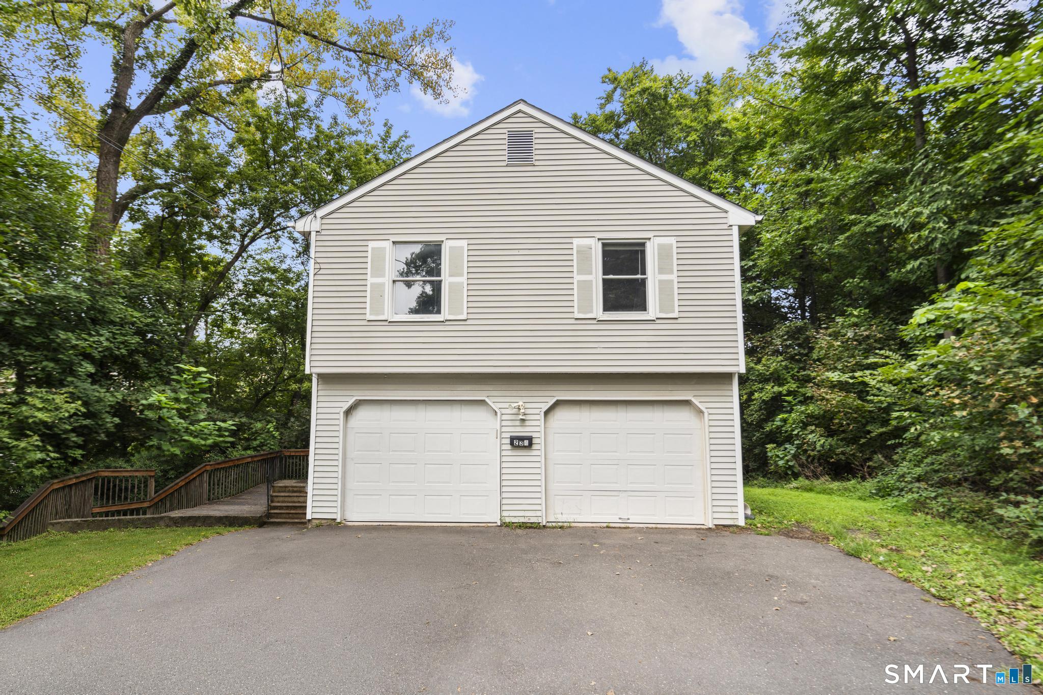 Exceptional investment opportunity located just a short walk to Central Connecticut State University! This spacious split-level home features 4-5 bedrooms, 2 full kitchens, and 2 full bathrooms, offering an ideal setup for student housing or multi-family living. The main level boasts a bright living room with high ceilings, an eat-in kitchen, a full bathroom, and 3 bedrooms, with direct access to a scenic/private wooded deck off the dining area. The lower level includes a second full kitchen, a full bathroom, and 2 additional bedrooms. Outside, the property provides a convenient 2-car attached garage and long driveway for ample parking. With a proven rental history and continuous tenancy since 2014, this property is a reliable income generator in a prime location. Property is being sold as is.