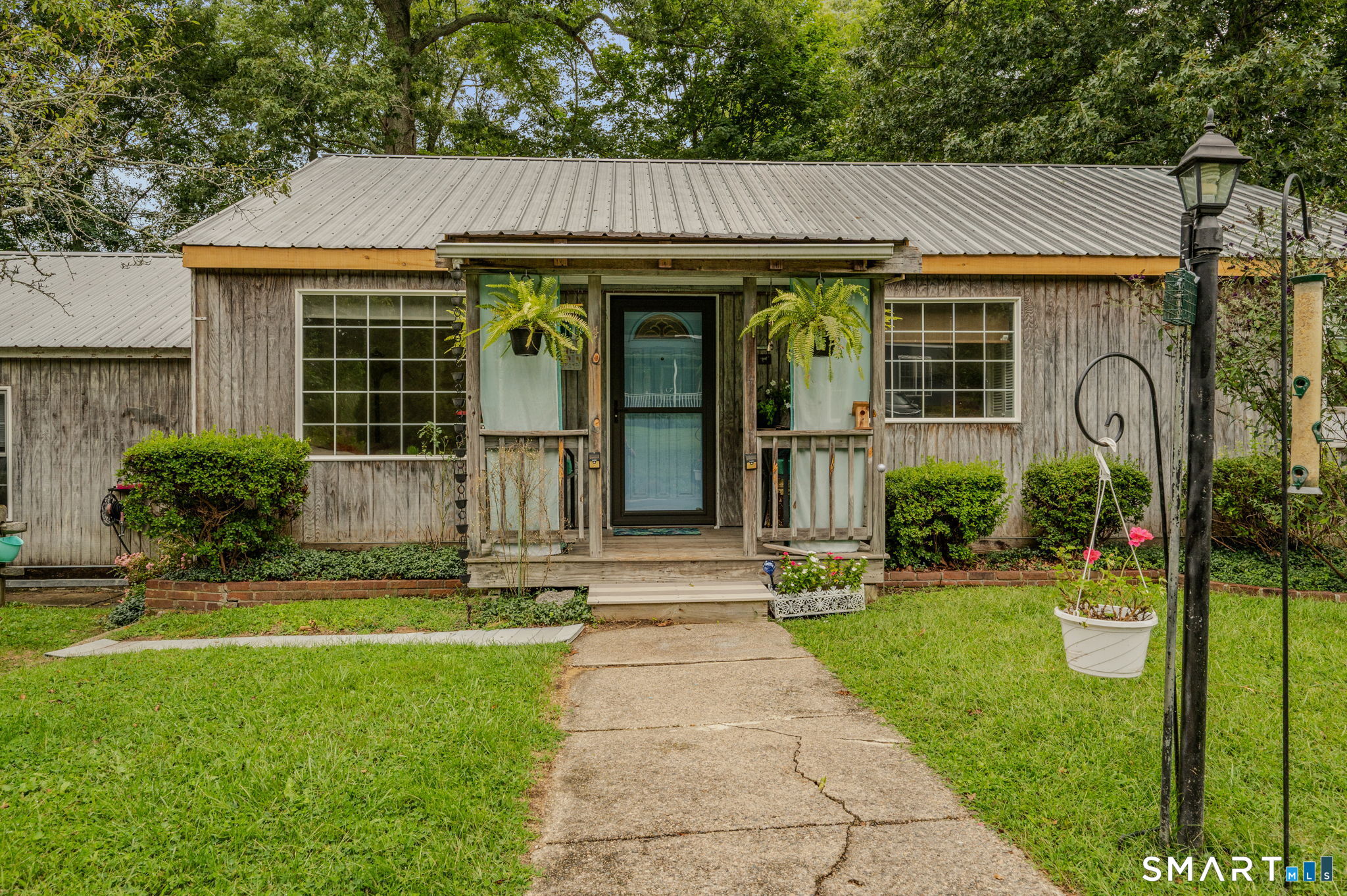 Welcome to 4 Marilyn Road in Waterford! Offered for the first time by its original owner, this three-bedroom, two-bath ranch provides comfortable one-level living with hardwood floors throughout. Recent improvements include a durable metal roof installed approximately nine years ago and a brand-new gas-fired hot-water baseboard heating system. The property still offers opportunities for updating, making it an ideal choice for buyers ready to bring their ideas and create a home of their own. Outside, the yard is filled with mature plantings and colorful flowers, providing a lovely setting to enjoy from the open front porch. Conveniently located near Route 1, I-95 and I-395, with shopping and restaurants just a short walk or drive away. Bring your vision and discover the possibilities!