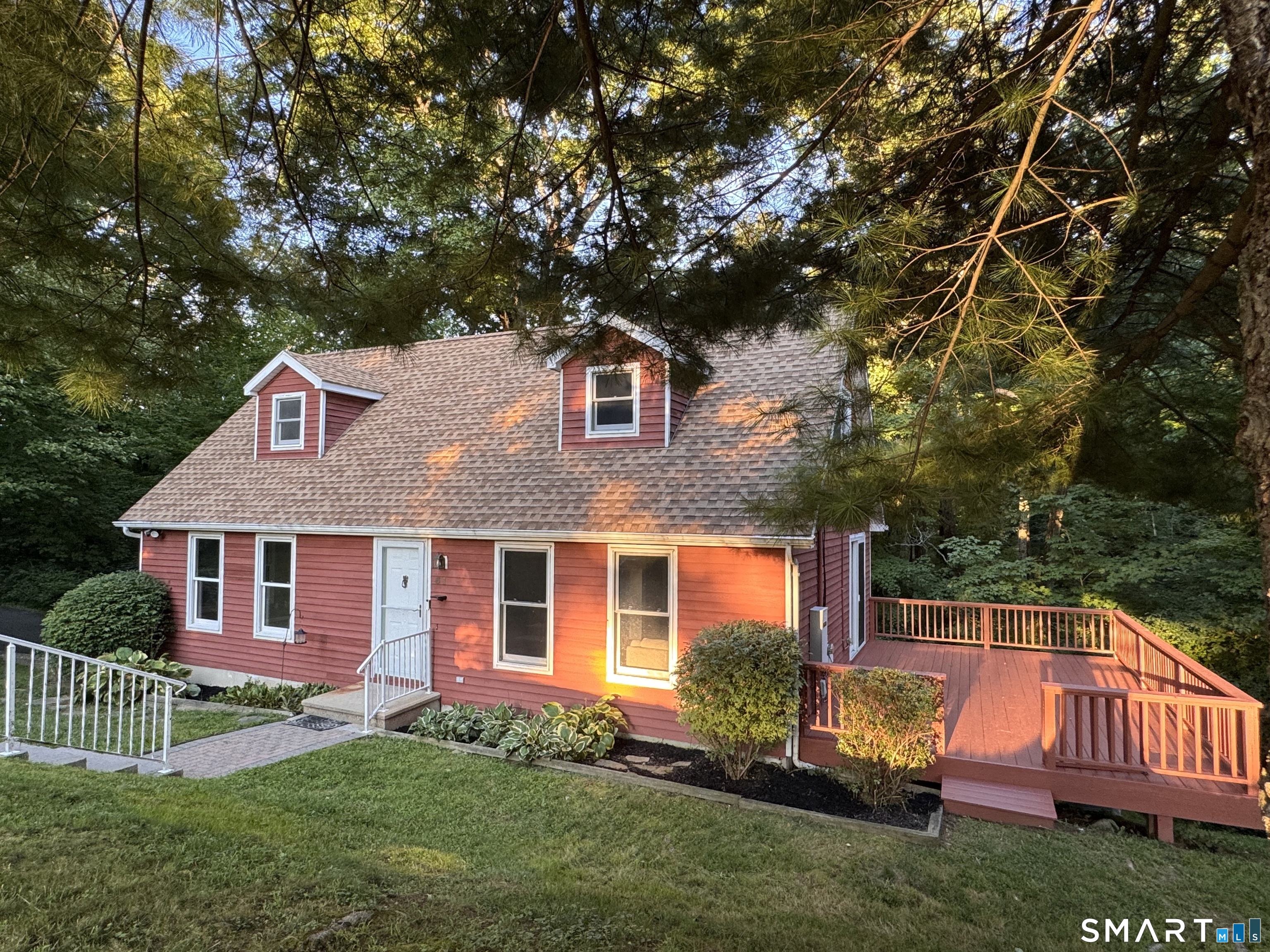 Move-in ready Cape set on 1.96 acres at the end of a cul-de-sac road. The main level offers a spacious eat-in kitchen, living room, and dining room with sliders opening to a large 24' x 14' deck. Rounding out the first floor is a den or home office and a full bath. Upstairs are 2 bedrooms and a second full bathroom, with charming doghouse dormers creating additional nooks and character. The finished lower level offers a family room with walk-out access to the back, along with a laundry area. Additional features include propane heat, central air, a generator, a two-car under-house garage, and plenty of parking with additional driveway space. Built in 1989. Central air approximately 2019, roof approximately 2011, furnace approximately 2015, and generator approximately 2013, per previous owner. Conveniently located with access to Routes 8 and 15, Yale University, Yale New Haven Hospital, and downtown New Haven. More information and professional photos coming soon.