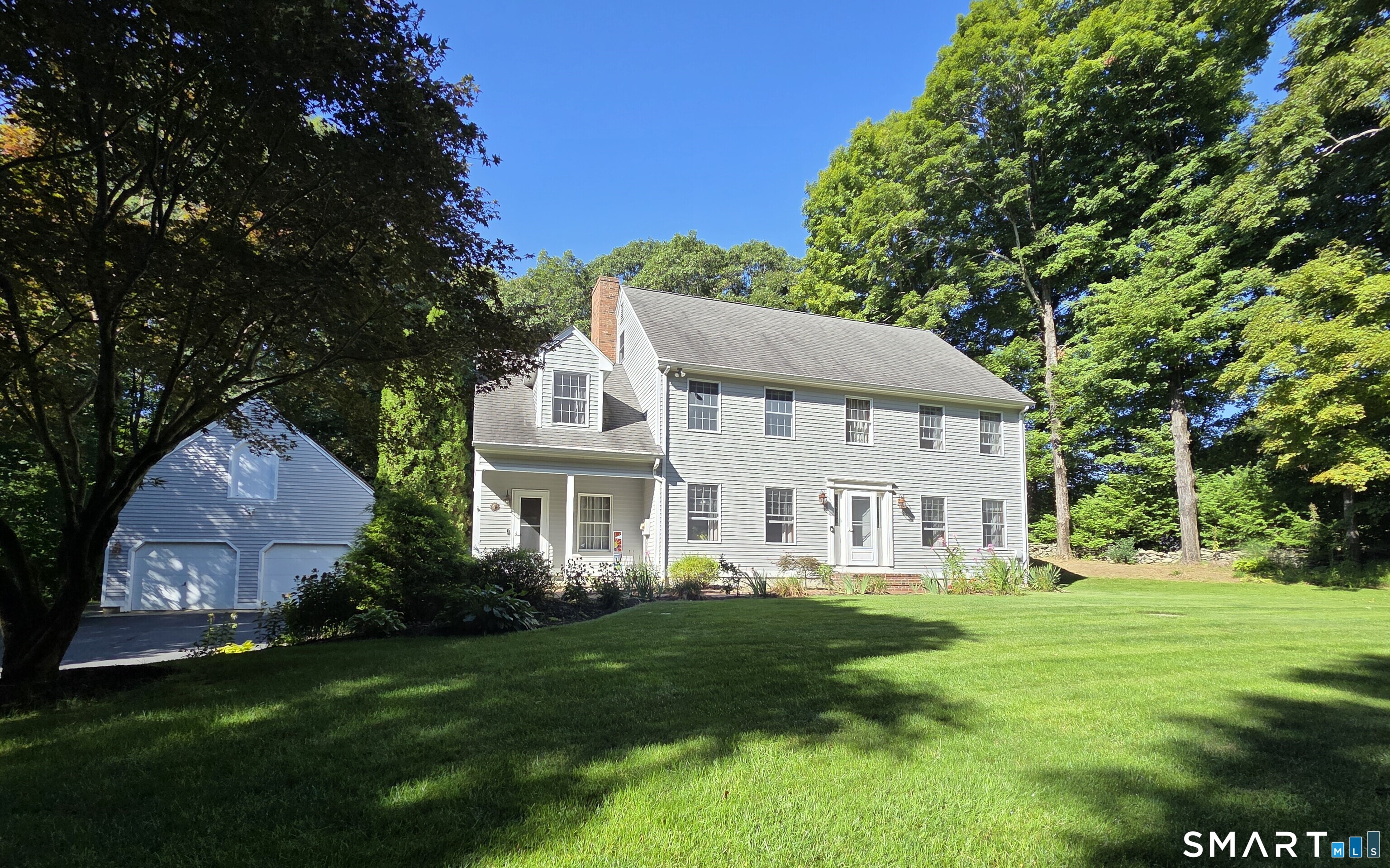 WELCOME HOME TO THIS MUST SEE 2,680' 9+ Room Colonial Style home located in one of the Highly Desirable Putnam areas. Situated on 3 Private Acres this home boasts a beautifully Remodeled Kitchen featuring Corian Countertops a Granite Center Island, SS Appliances along with Bay Window! Open to the Formal Dining Room & also steps down into the Warm & Inviting Brick Fireplaced Family Room. On the other side of the home is another Living Room area as well as a Study/Office for those who work from home. A good portion of the home has Beautiful Hardwood Floors! Upstairs boasts 4 Spacious Bedrooms! Large Master BR with Hardwoods, Walk-in Closet & Full Bath with Granite Vanity! Another Full Bath with Double Sinks & Linen Closet! Full Walk-up Attic with Plumbing Leads for even more Additional/Future Expansion! Basement has approx. another 562 Heated finished sq ft for Gym/Craft area! Whole House Fan! Buderus Furnace w/5 Zone Oil Heat! 24X30' Detached Garage with Second Floor Loft for Storage! Jump into your Hot Tub through the sliders off of the Family Room that lead to your own Private Back Yard Oasis w/ Patio/Deck Area, Fire Pit! Location is Convenient to Everything Putnam!!