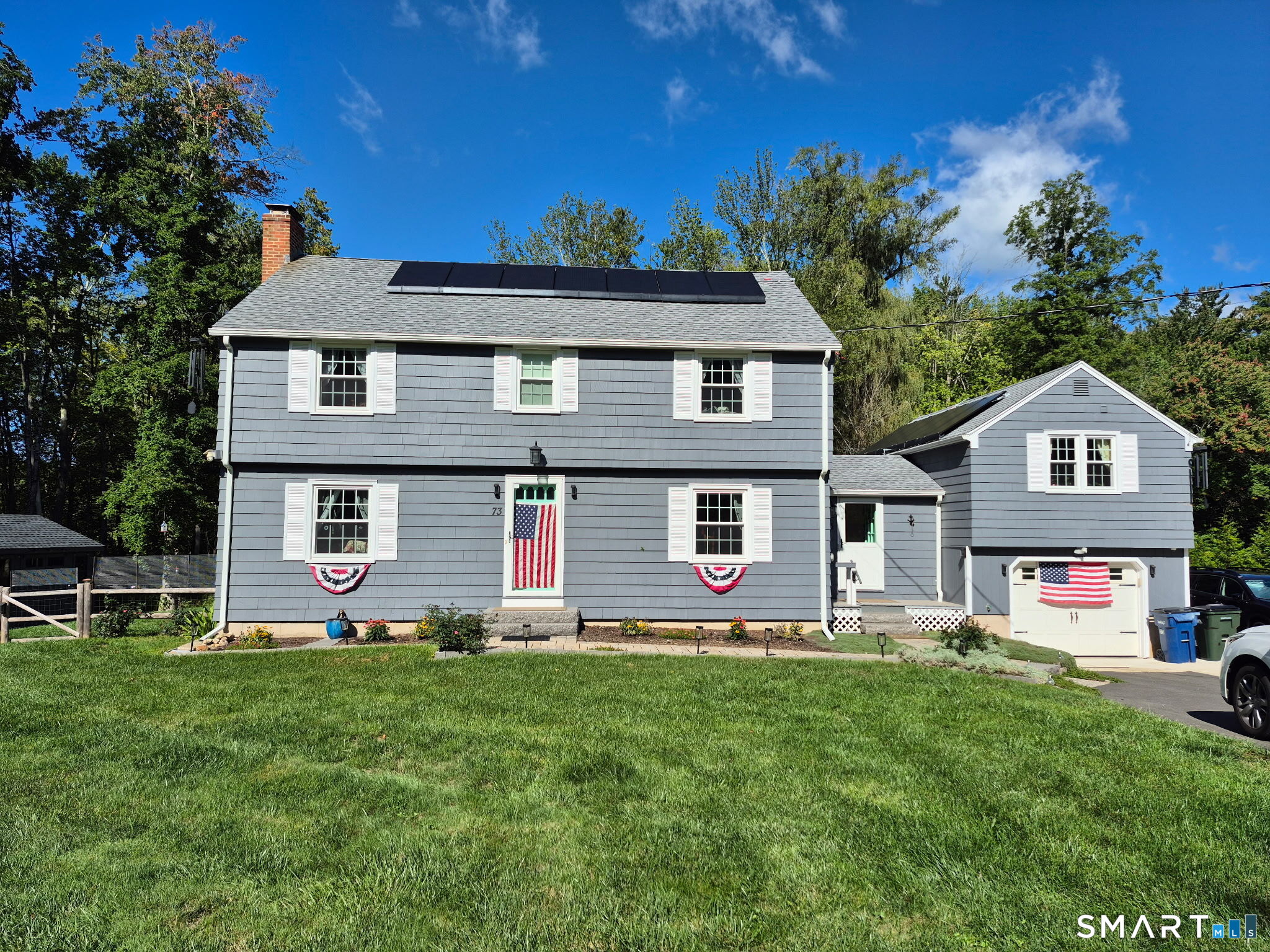 Beautiful 5-bedroom colonial set on a lovely lot in prime Granby location. This move-in-ready home offers the perfect blend of classic charm, modern updates, and comfortable living space. On the main level you will enjoy a large front-to-back living room with picture window and fireplace, a spacious dining room and updated kitchen with granite counter tops. This home offers plenty of room for family and friends with hardwood flooring throughout. 5-bedrooms plus another room perfect for a 6th bedroom, guest area, family room or home office. Outdoor spaces include a spacious yard, level lot and inviting deck and patio area with pergola. This home is move in ready with many recent updates. Come fall in love with 73 Bushy Hill Road! Professional photos will be available by 9/16.