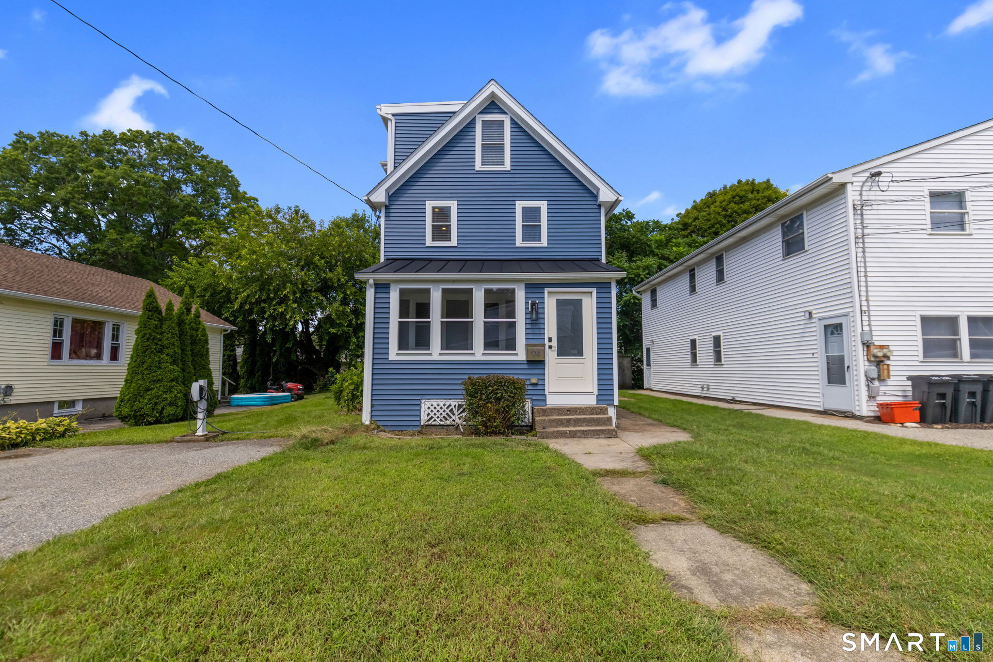 Welcome to Groton! This well-maintained, updated colonial home has been generously updated with new windows, siding and interior appointments. Step in from the enclosed front porch and guests are greeted to a bright open family room, large eat-in kitchen and first floor laundry and powder room. The kichen features plentful cabinety, stainless steel appliances and breakfast bar. Hardwoods gleam throught the main level space. Ascend the stairs to find a large primary bedroom with attached full bathroom as well as the main full bathroom that serves the additional two bedrooms. Ascend to the third floor to find two additional bedrooms with plentiful closet space. The level yard is perfect for gardening, entertaining and features a storage shed. Tesla and EV owners will find the added convenience of level two charger installed at the end of the driveway. Conveniently located to Electric Boat, General Dynamics, local shops, eateries and just minutes to i95. Welcome home!