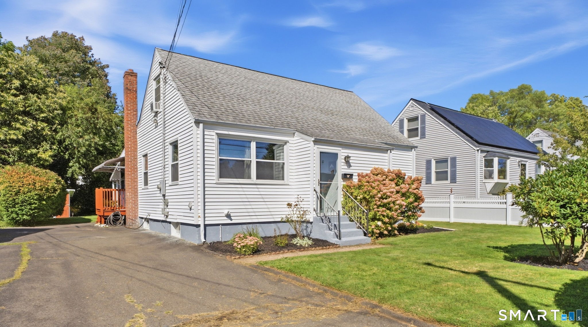 Welcome to 141 Alexander Rd, a charming, well-maintained Cape where you can unpack, and enjoy your new home from day one. The living room with plenty of natural light, currently called the "Long Room" is made for long, relaxing evenings or hanging out with friends. The kitchen, featuring dark cabinetry, SS appliances, and a large butcher-block island with prep space and seating, naturally flows into the dining area, perfect for meals and entertaining. A spacious first-floor bedroom with three closets is near the full bath, offering easy one-level living. Upstairs are two additional bedrooms, ideal for a home office, hobby room, and/or guests. The unfinished lower level currently offers furnished, usable space for recreation, exercise, laundry, and storage. Outside, enjoy a private, level, mature-hedge-lined backyard with a large covered patio, string lighting, and plenty of lawn space, perfect for summer evenings and bonfires. Updates include tankless gas water heater/boiler with multiple zones (2020), new dishwasher (2026), added basement insulation (2023), and kitchen remodel (2019). Located in a very walkable neighborhood, near newly renovated Batterson Park and recently redone Holmes Elementary School; with shopping and dining near Westfarms Mall and easy highway access. A move-in-ready home with space, flexibility, and a location that makes everyday living easy.