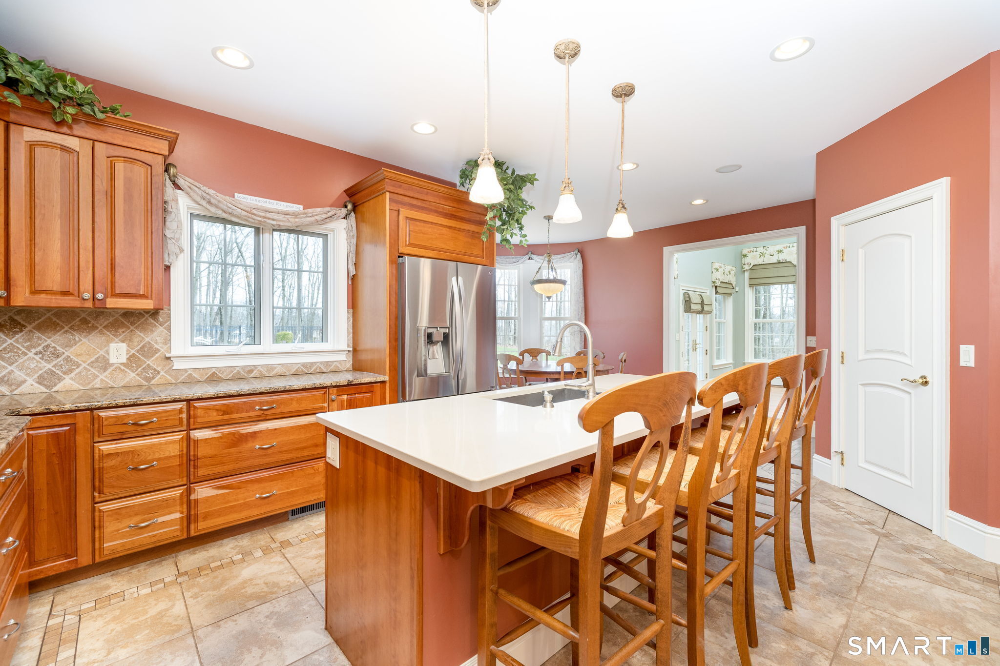 View of the walk-in pantry. The panel over the refrigerator opens for additional storage. The kitchen opens to the sunroom, family room, and dining room!