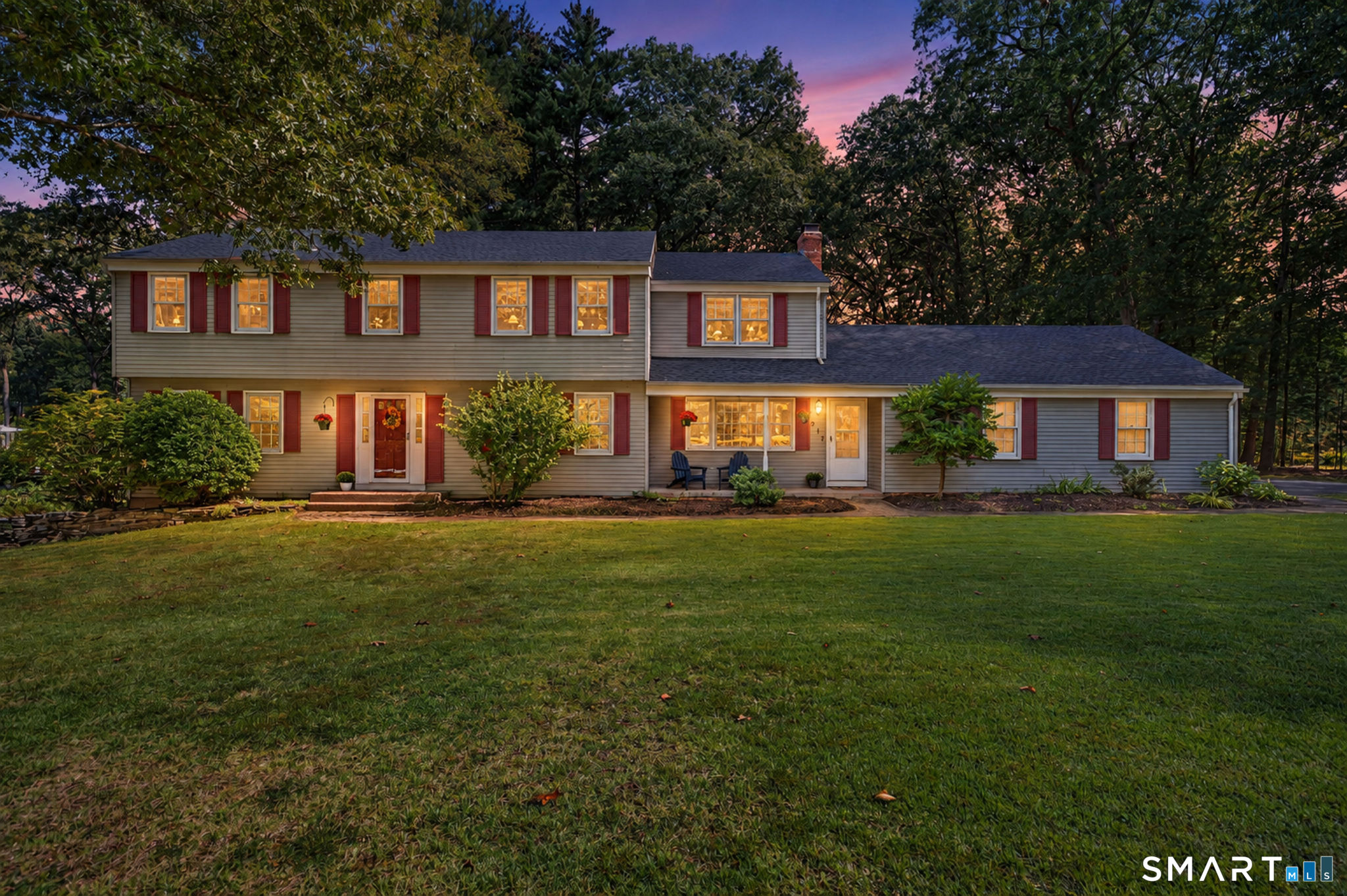 Fabulous 10-room, 5- BEDROOM Colonial, nestled on a level, park-like .96 acres, in a location boasting convenient access to schools, highways, shopping and two golf courses. "Spectacular" is an understatement for the stunning kitchen, remodeled to the hilt with an expansive array of beautiful maple cabinetry, 10x12 center island comfortably seating 6, granite countertops, and upscale appliances including Viking professional 6-burner gas range with convection oven and hood. The kitchen opens to a spacious, inviting family room featuring fireplace and custom built-ins. Generously sized front-to-back living room, anchored by a 2nd fireplace, offers versatility for TV viewing, playroom, music room, or simply a comfortable place to relax. Also on the main level are dining room with built-in china cabinets, mudroom with brick accent wall and closets, laundry room and 1/2 bath. Upstairs are 5 ACTUAL BEDROOMS, including an ensuite primary with updated bathroom and huge walk-in closet, 4 additional bedrooms boasting walk-in closets or built-ins, and an updated hallway bathroom. The recently finished (2022) walk-out lower level with stylish vinyl plank flooring, adds 960 sq ft of open layout living for recreation, media and office. Outside, enjoy a beautiful covered porch and Trex deck overlooking serene, private yard with lush gardens. Additional amenities: New Roof 2025, New Driveway 2024, New Septic System 2015, Public Water, Nat. Gas Heat, Hardwood Flooring, 2-car attached garage.