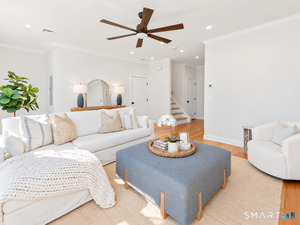 The spacious living room provides plenty of room for family and friends to relax and gather.