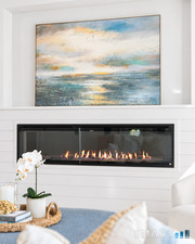 Relax and unwind in the living room by the warmth and ambiance of the fireplace.