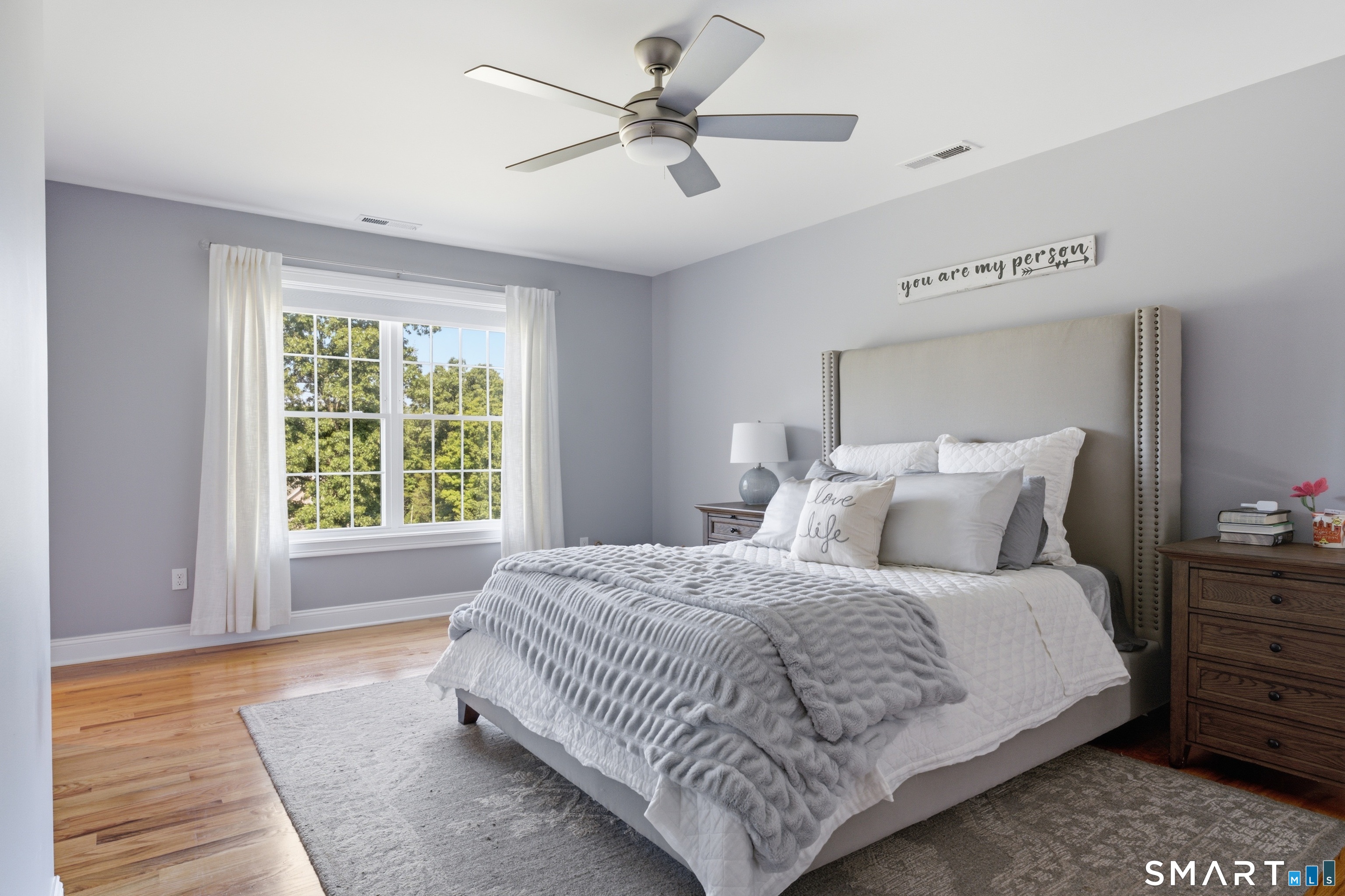 Wow, primary suite with hardwood floors.