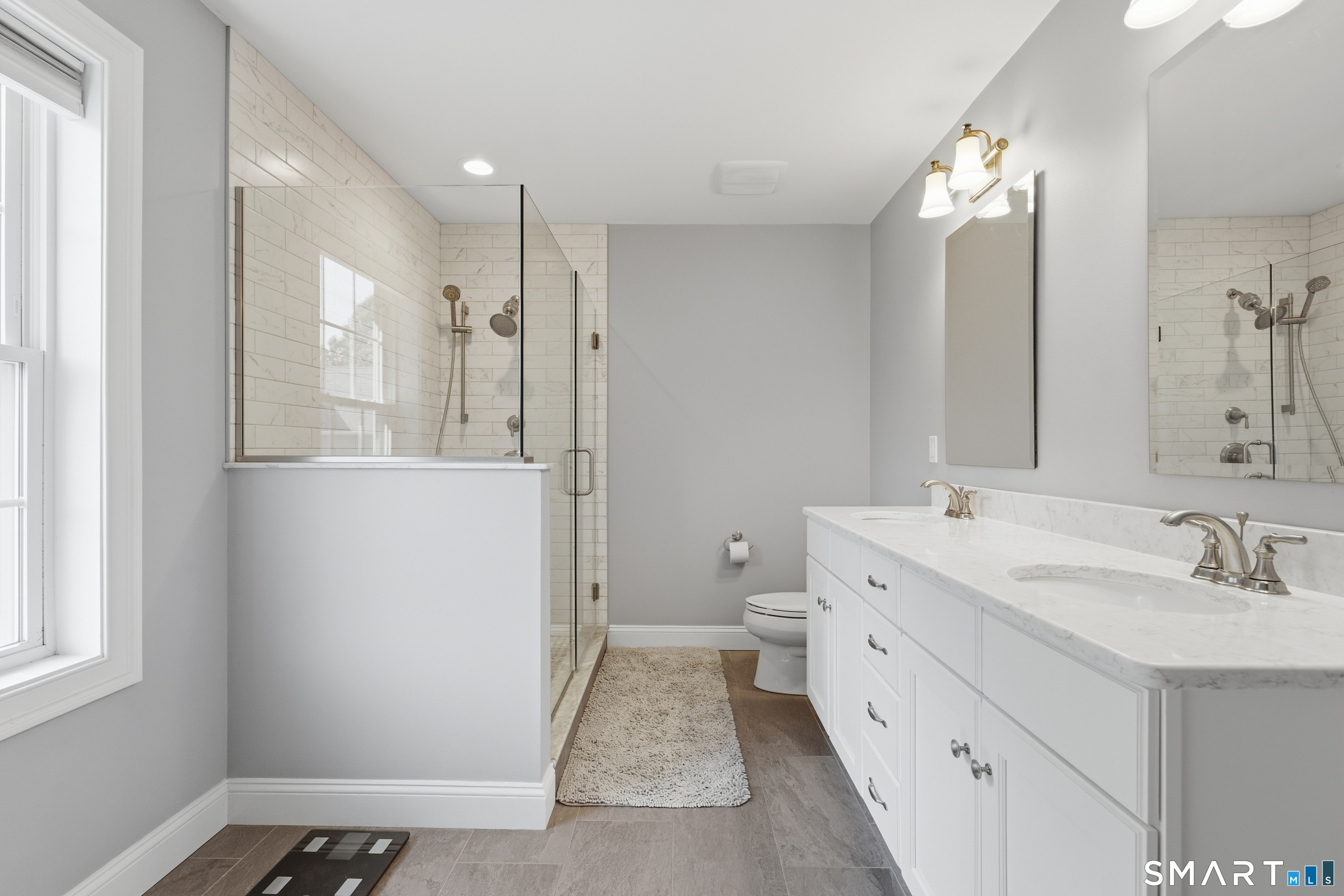 Spa like primary suite bathroom.