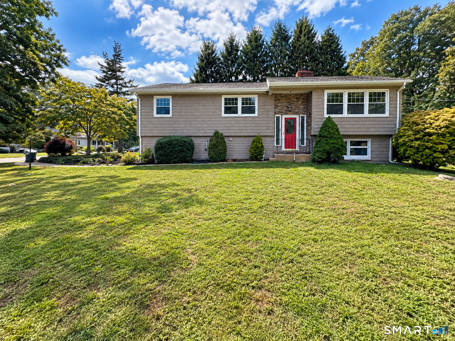 This well cared for raised ranch offers 4 bedrooms, 2.5 baths, a two car garage and a corner lot. The main level features hardwood floors, a spacious living room with a classic fireplace, dining area and kitchen. A sunroom filled with natural light and featuring a warm wood plank ceiling provides a welcoming space to relax and enjoy the surroundings. The lower level offers additional living space with a family room featuring a fireplace insert along with versatile space that can be used as a home office or recreation area. Ample storage and a flexible layout provide room to suit a variety of needs. Located in the South Glenwoods neighborhood of Gales Ferry with easy access to Route 12, Naval Submarine Base New London, Groton and New London, shopping, dining and Mohegan Sun while still enjoying a quiet residential setting.