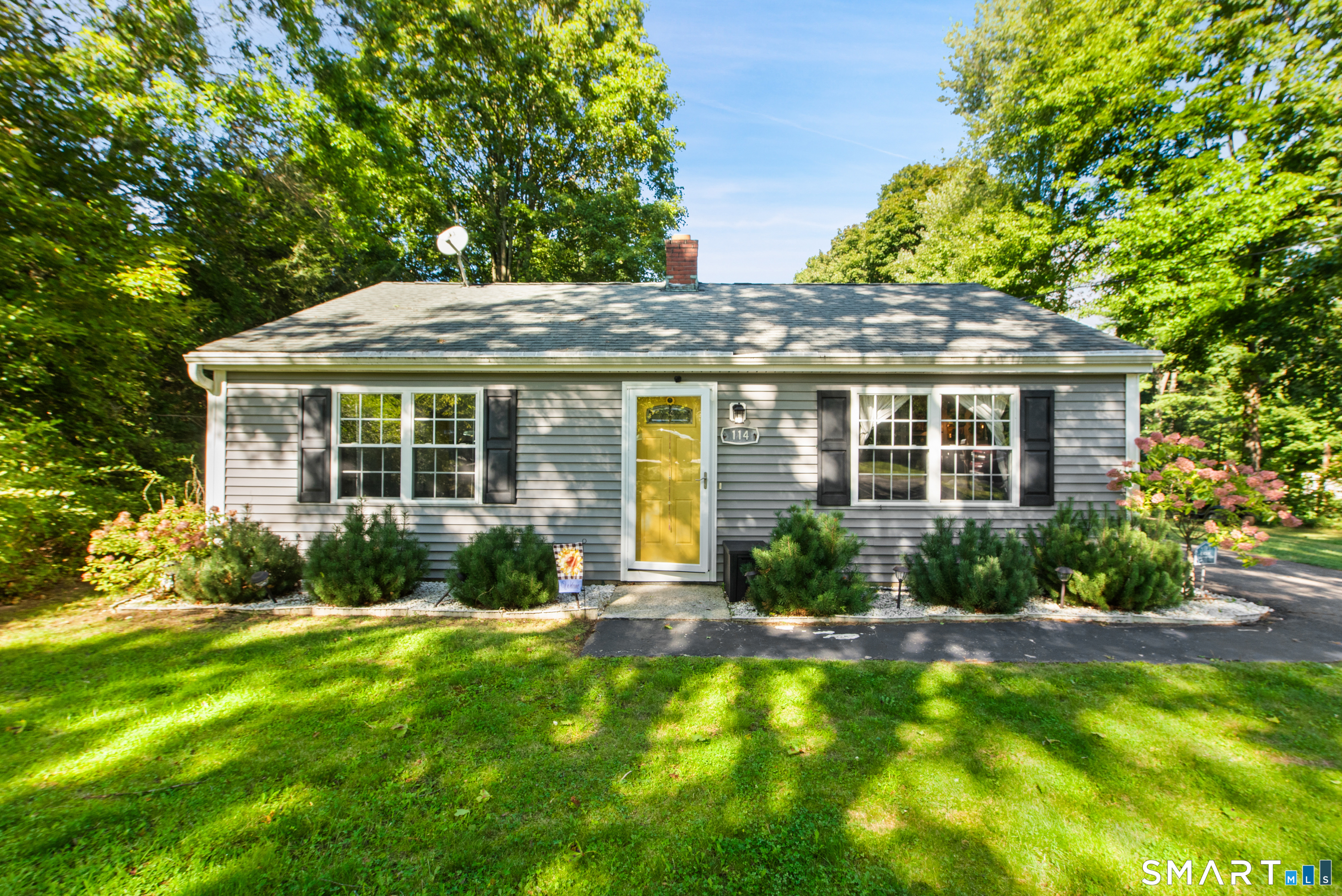 Move right into this charming ranch home nestled on nearly an acre of level, private property in desirable South Cheshire. Perfect for first-time buyers, downsizers, or anyone seeking easy one-level living, this turn-key home offers an ideal blend of comfort, style, and convenience. You are greeted to find a bright and inviting living room and completely updated eat-in kitchen with granite countertops, stainless steel appliances, and abundant cabinet space. The home offers two comfortable bedrooms, a refreshed full bath, and laminate wood look flooring throughout. Major improvements include updated mechanicals, energy-efficient on-demand hot water, hydro-air propane heating and vinyl siding. A one car garage is also an added bonus. The show stopper is the expansive backyard oasis with deck, firepit, flowers, exceptional privacy and plenty of room for entertaining, gardening, recreation, or simply relaxing in a peaceful setting. Conveniently located close to shopping, parks, restaurants, the Farmington Trail, Award Winning Norton Elementary School, and major commuting routes, this charming home offers a wonderful lifestyle in a sought-after neighborhood. Don't miss this fantastic opportunity to own a move-in-ready home in one of Cheshire's most desirable locations. Schedule your showing today!