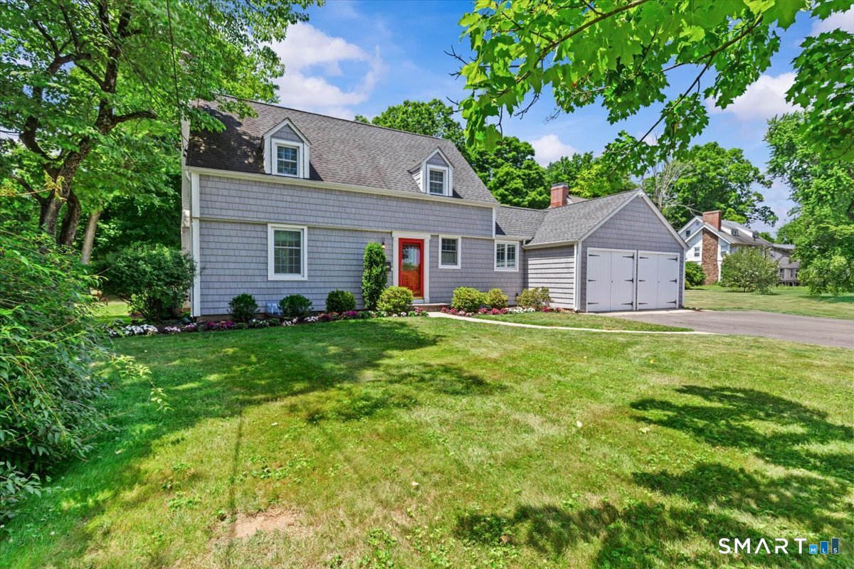 This beautifully maintained three-bedroom, two-bath Cape is perfectly situated just minutes from the vibrant shops, restaurants, and amenities of West Hartford Center and Blue Back Square. Set on a generous .62-acre lot, the home effortlessly blends character with modern comfort. Sun-drenched living areas create a welcoming ambiance, enhanced by thoughtful updates including an updated kitchen, central air, and recessed lighting, alongside classic features like a curved staircase and hardwood floors-truly move-in ready. The modern, open kitchen boasts a large island, abundant natural light, and direct access to the patio, flowing seamlessly into the spacious living room with a wood-burning fireplace. The main level also offers a full bath and a sizable mudroom with direct access to the two-car garage and one of two backyard patios. Upstairs, three bedrooms and a full bath are reached via the elegant curved staircase, while the lower level provides ample storage and a finished rec room, ideal for a playroom or movie nights. The expansive backyard offers exceptional outdoor space for recreation, gardening, and entertaining, complete with a private putting green for golf enthusiasts or casual enjoyment.