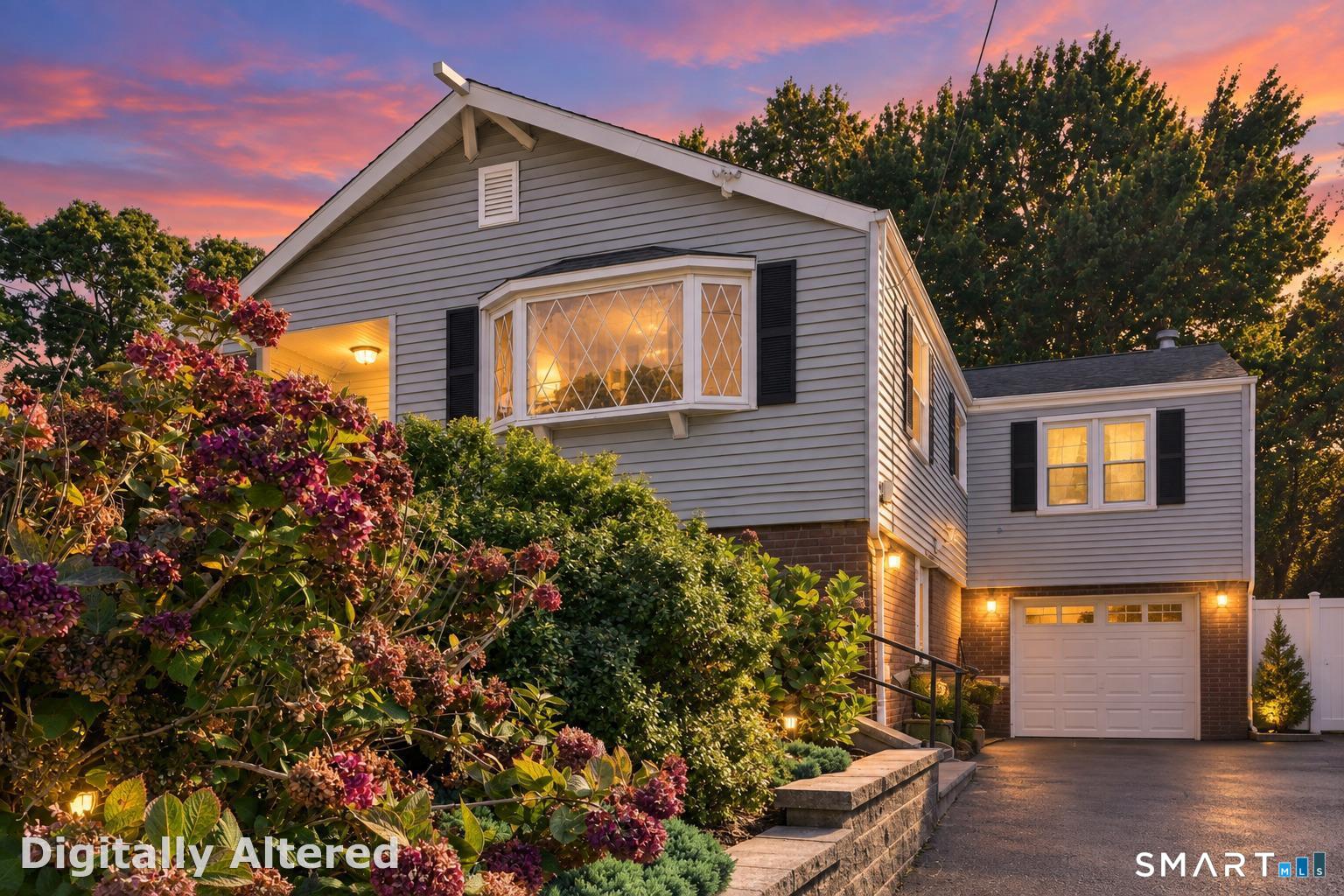 Welcome to 103 Central Avenue, ideally located in West Haven's desirable West Shore neighborhood! This inviting home offers a flexible layout, finished lower level, attached garage and fully fenced backyard. The main level features two separate living areas, with the traditional dining room currently used as a second living space to accommodate a multigenerational household. The living room features a fireplace and sliders opening directly to the fenced backyard. The home is currently configured with two bedrooms, while the third has been transformed into an oversized walk-in closet thoughtfully designed for easy conversion back to a bedroom. The remodeled finished lower level (2021) adds valuable living and entertaining space with a bar and half bath, plus laundry and interior access to the one-car attached garage. Additional improvements include a gas furnace replaced in 2019 and sump pump and French drain system added in 2021. A versatile West Shore home ready to adapt to your lifestyle!