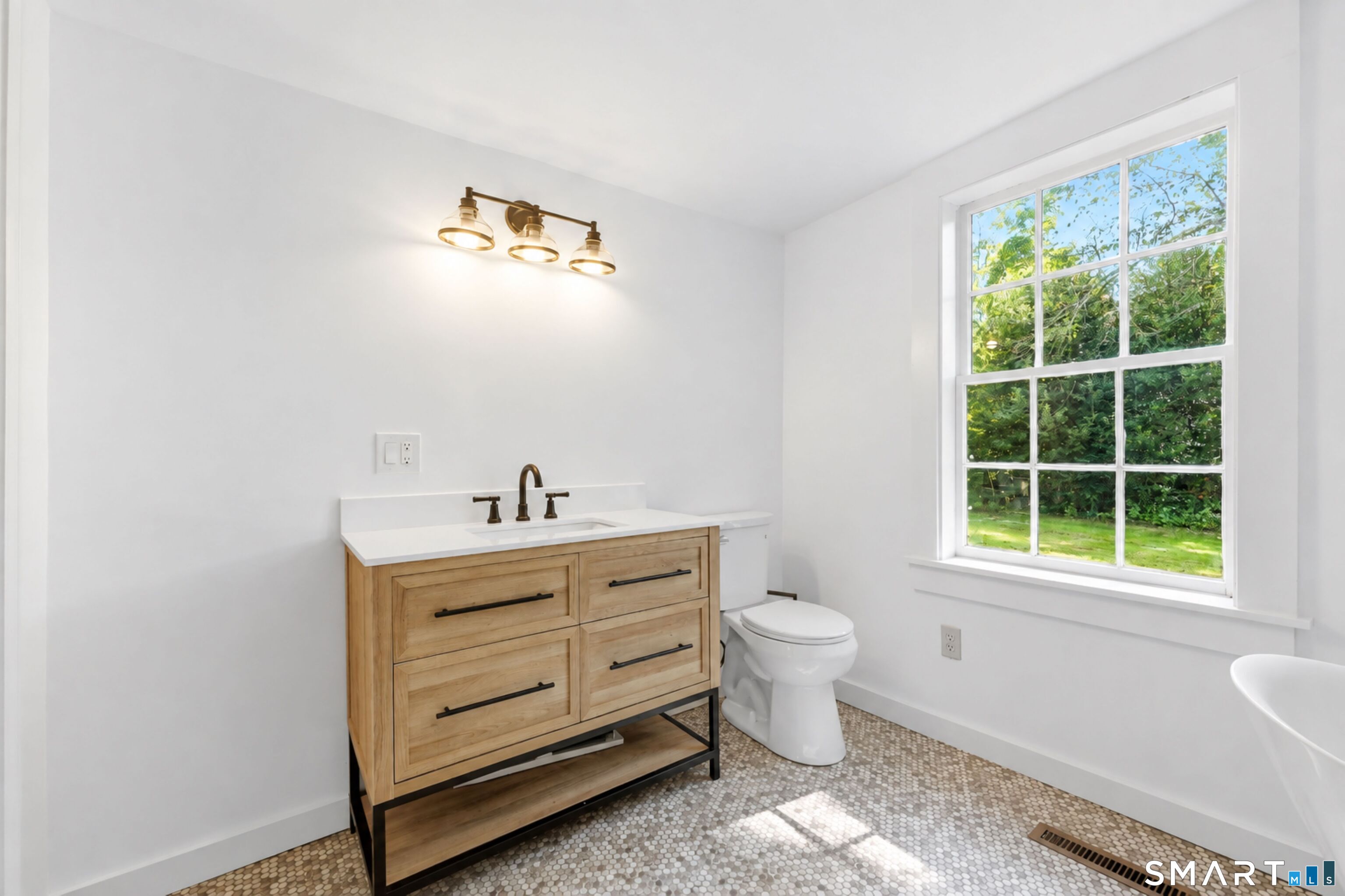 Fully renovated main level full bathroom offers convenience and flexibility to this floor plan.