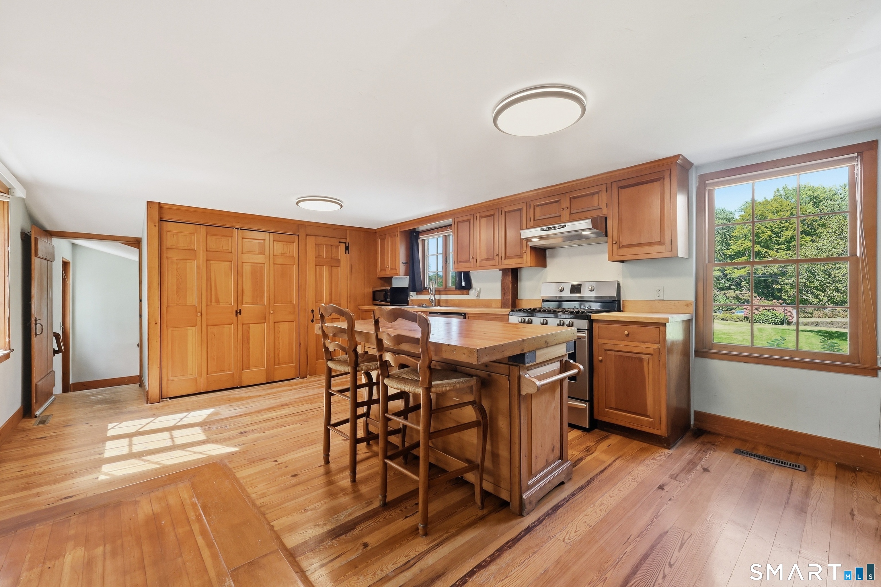 Well laid-out cabinetry and separate pantry provide excellent storage.