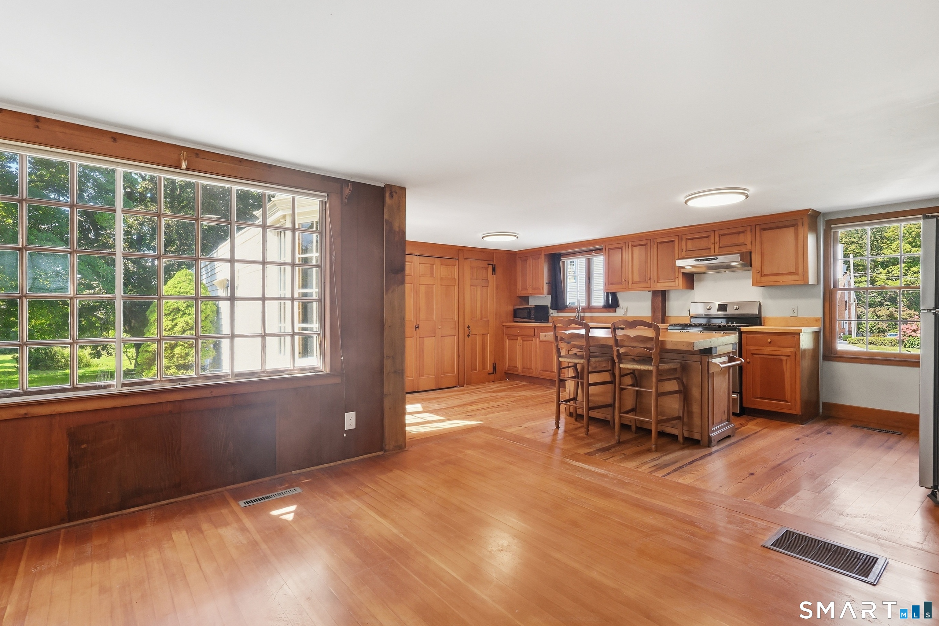 Kitchen naturally flows into large dining room.